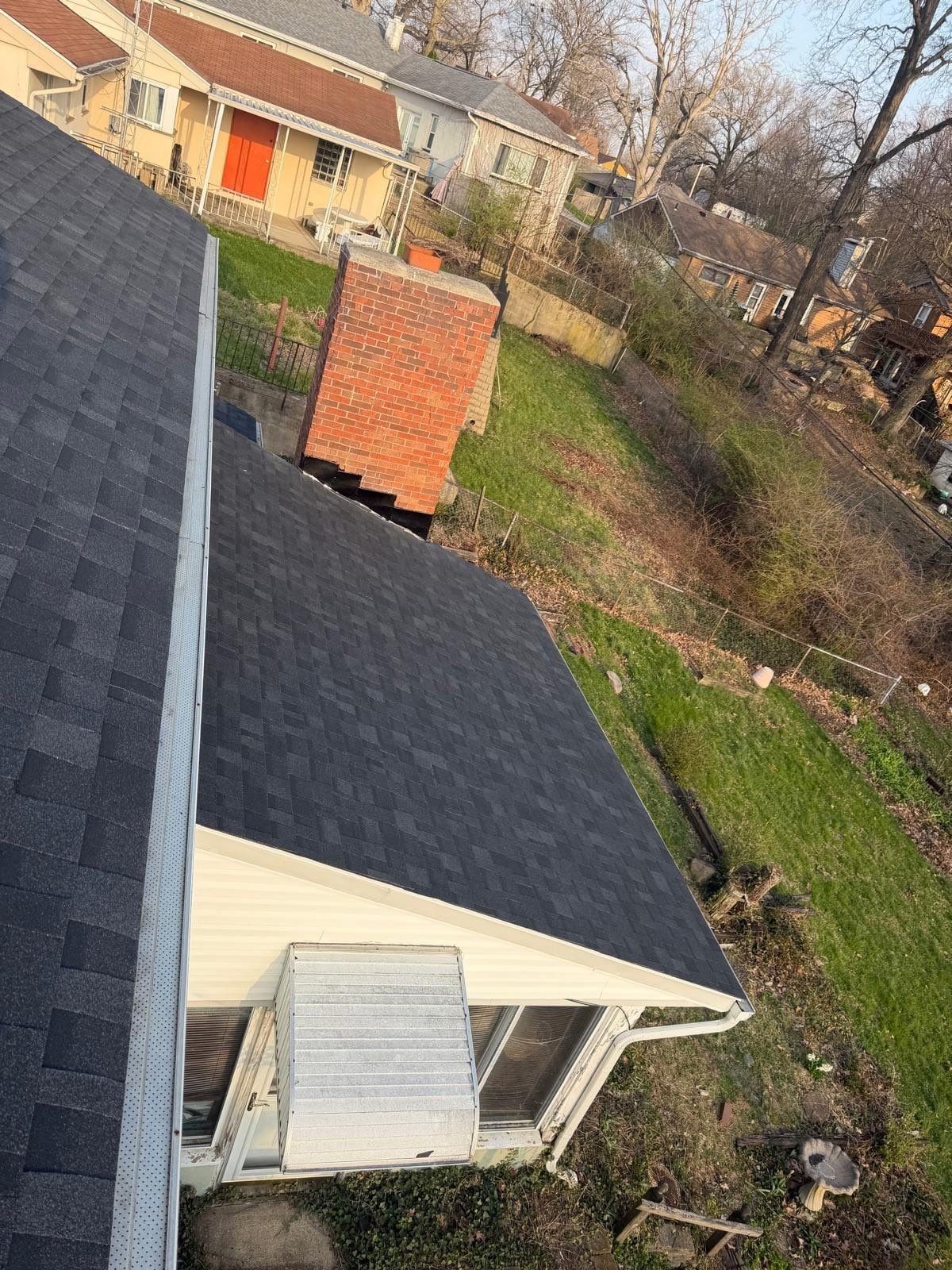 The finished roof over the side of the house and the brick chimney, Dayton, Ohio.