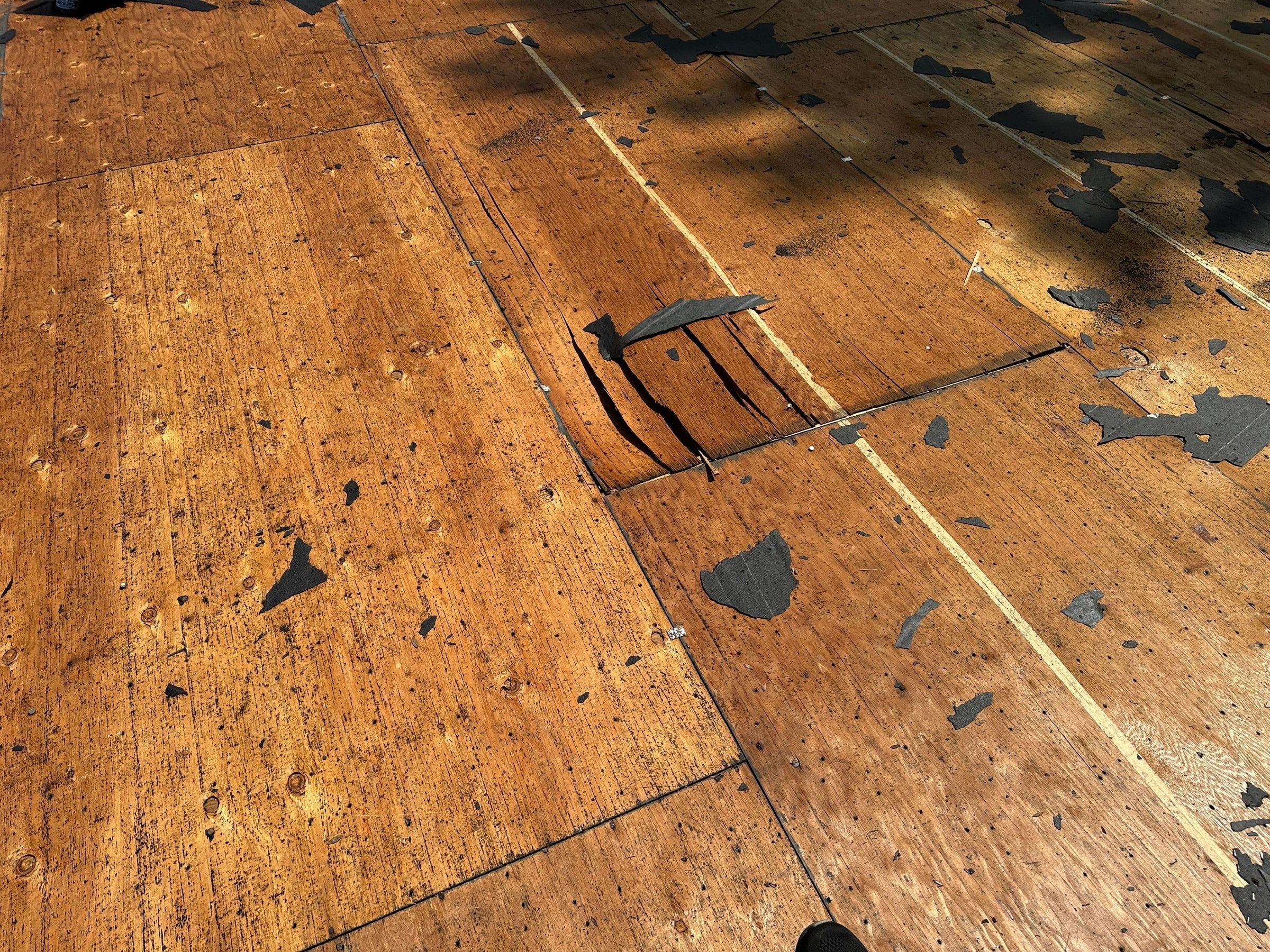 Delaminated plywood peeling apart in the old deck, Beavercreek, Ohio.