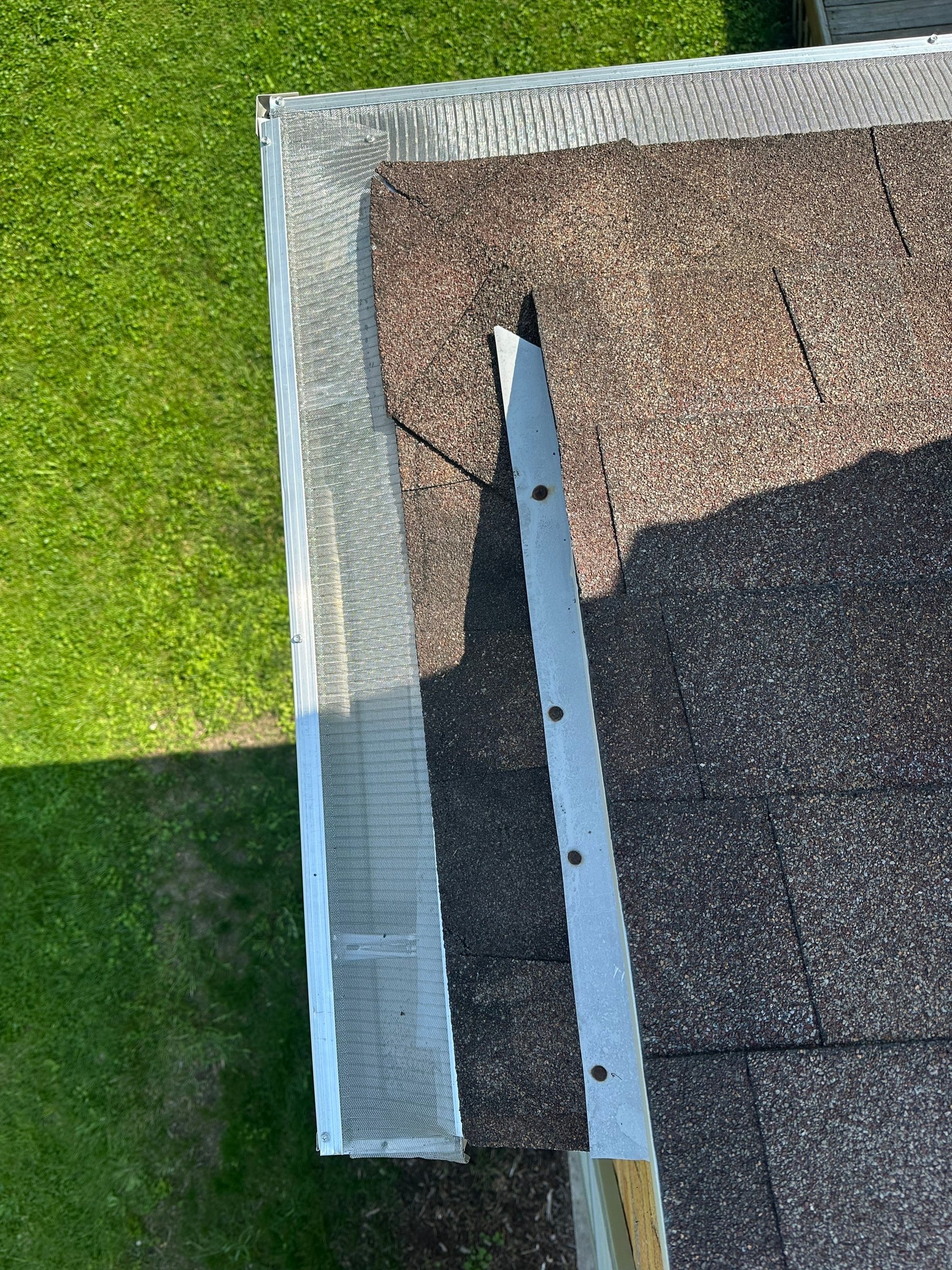 Length of new metal on the shingles