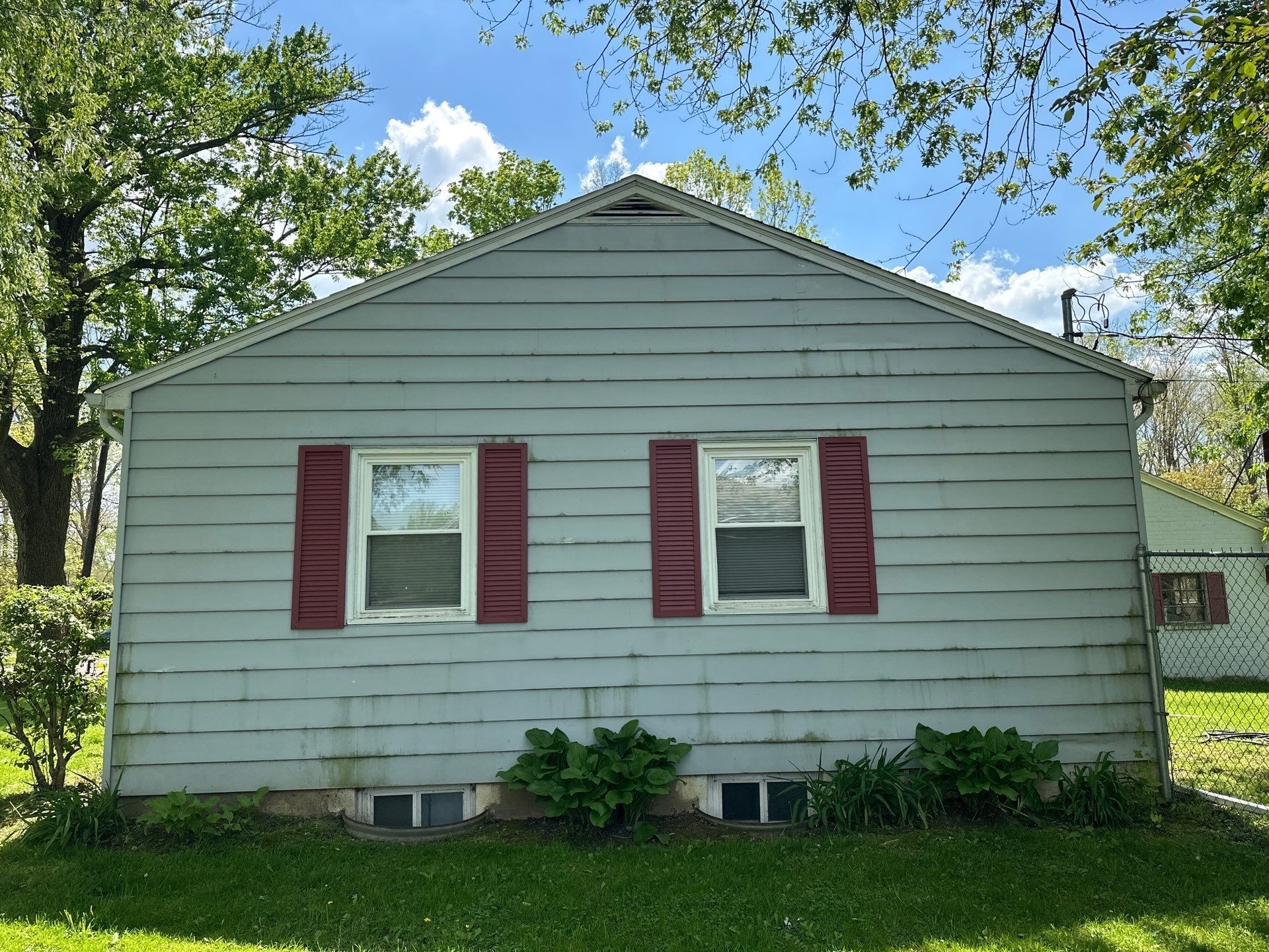 The side of the house with red shutters and the old lap siding, Beavercreek, Ohio.
