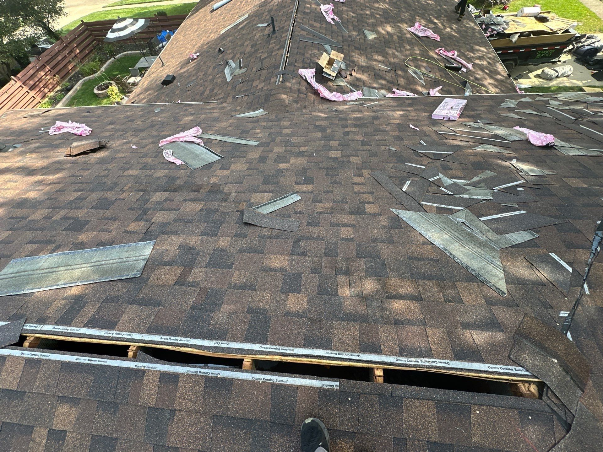 New shingles below the open ridge, with flashing pieces set out, Dayton, Ohio.