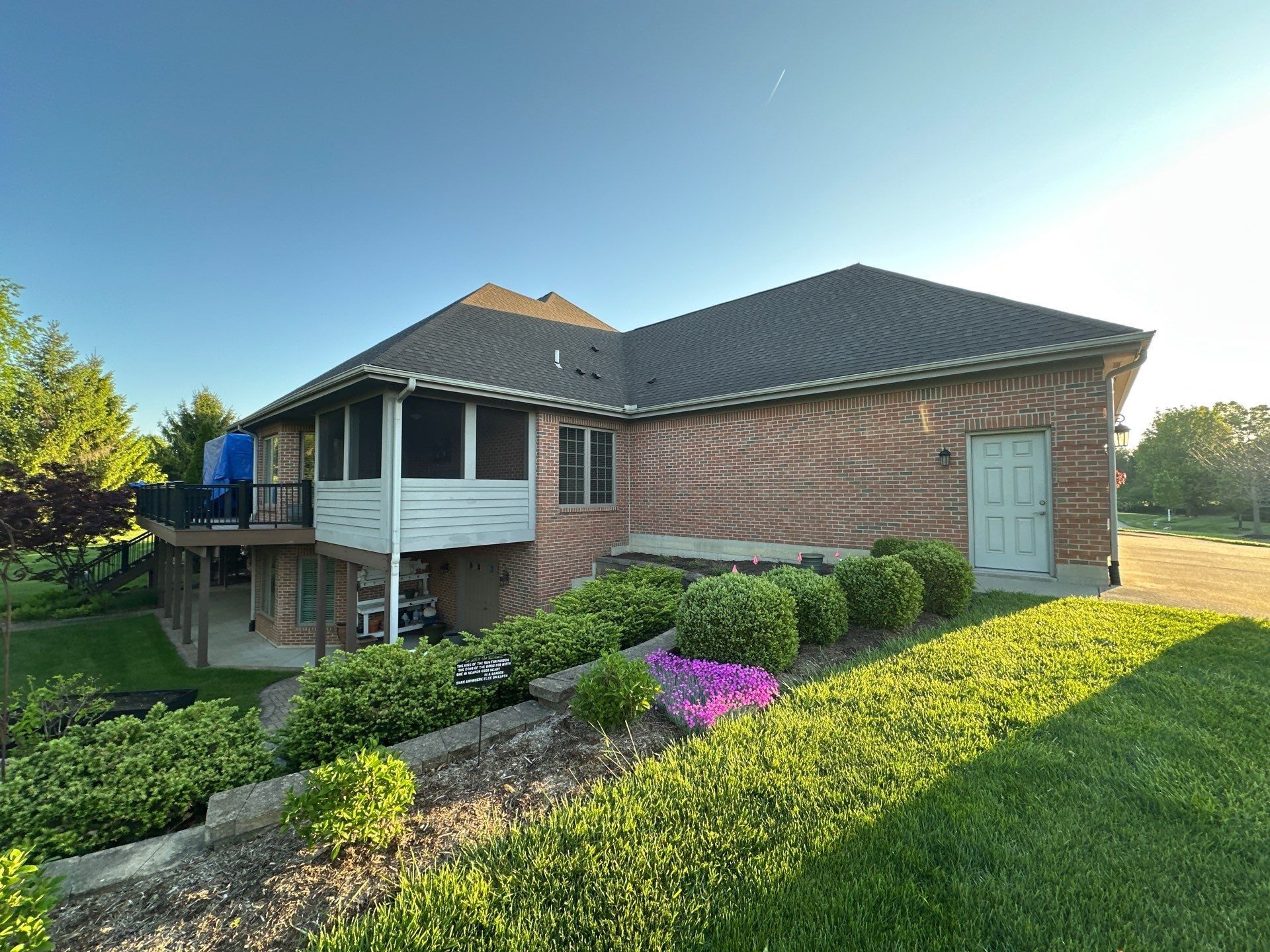 Rear of the house and covered deck rail