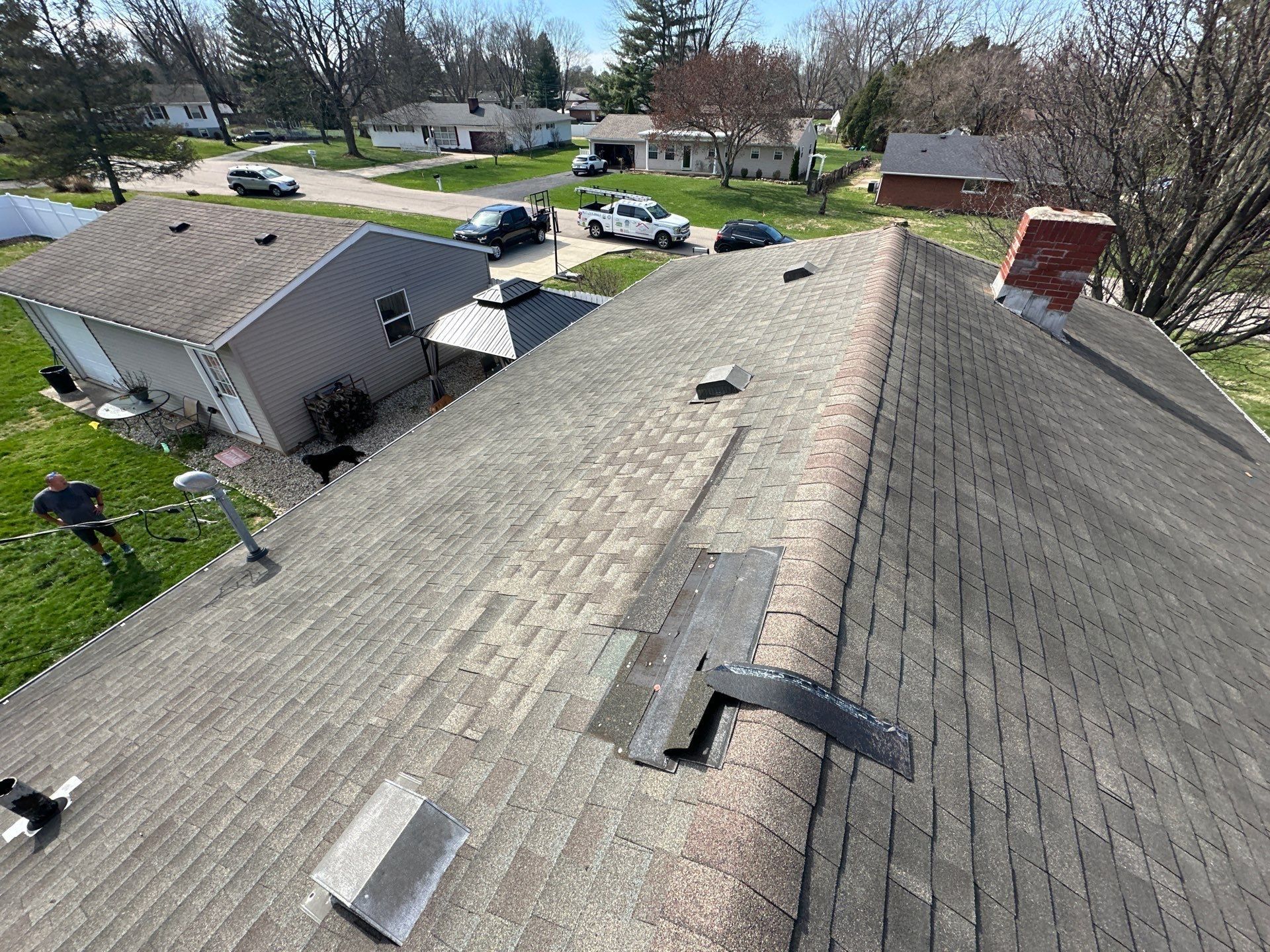 Drone photo of wind damage: shingles torn off near the ridge, Beavercreek, Ohio.