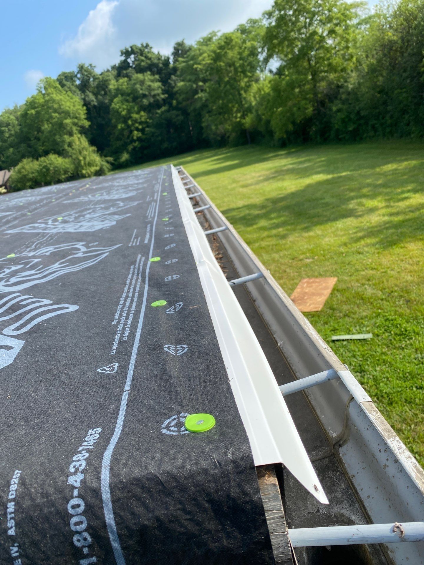 Drip edge over underlayment along the garage gutter, Yellow Springs, Ohio.
