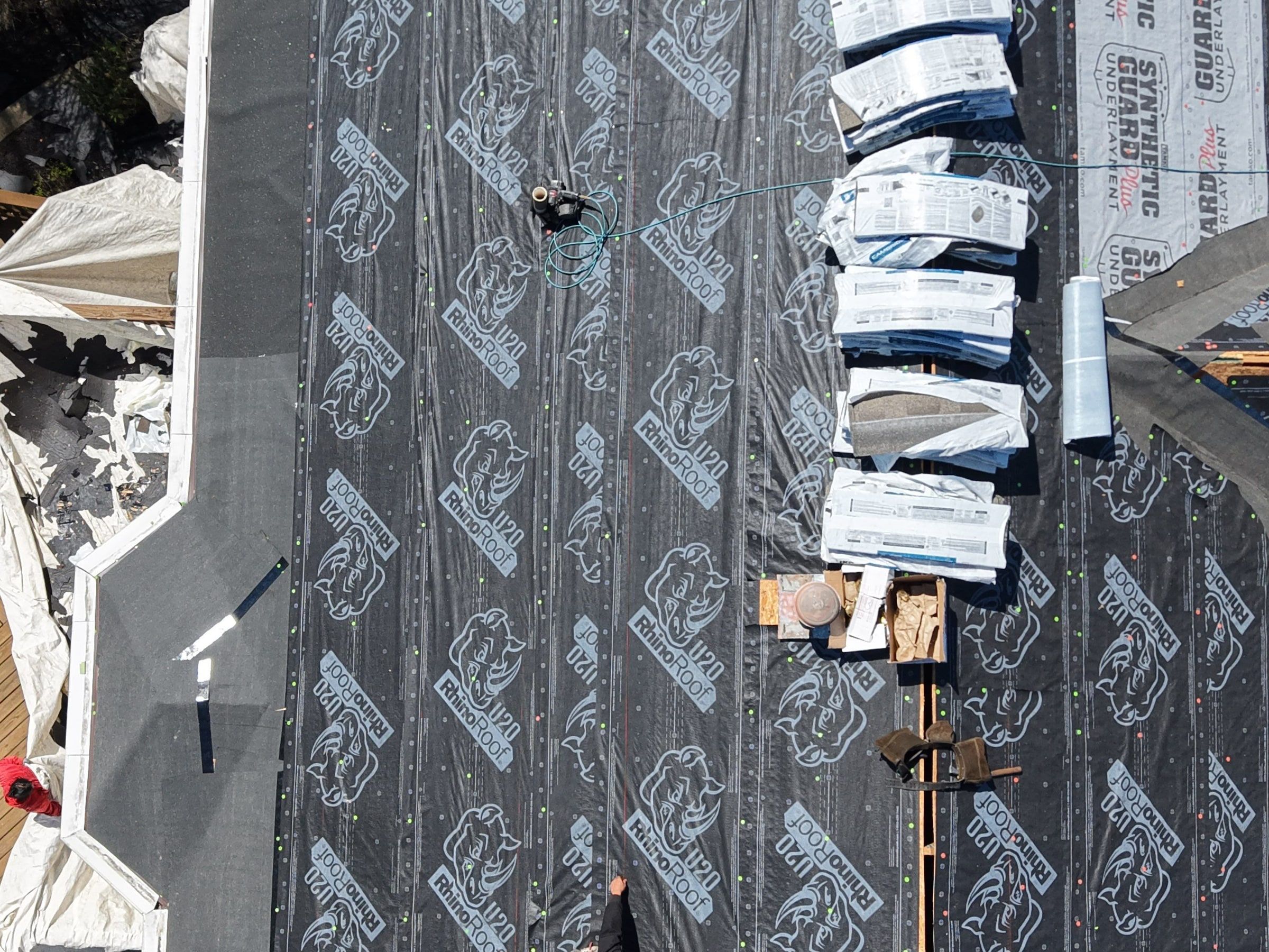 Underlayment and bundles staged in a line
