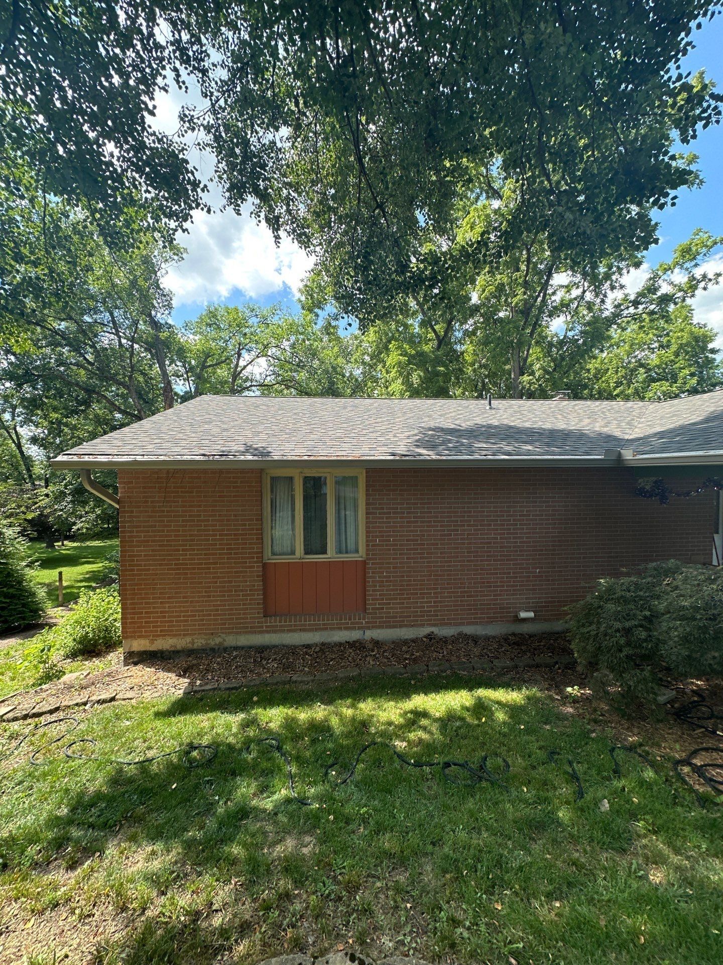 Back of the house across the rear lawn