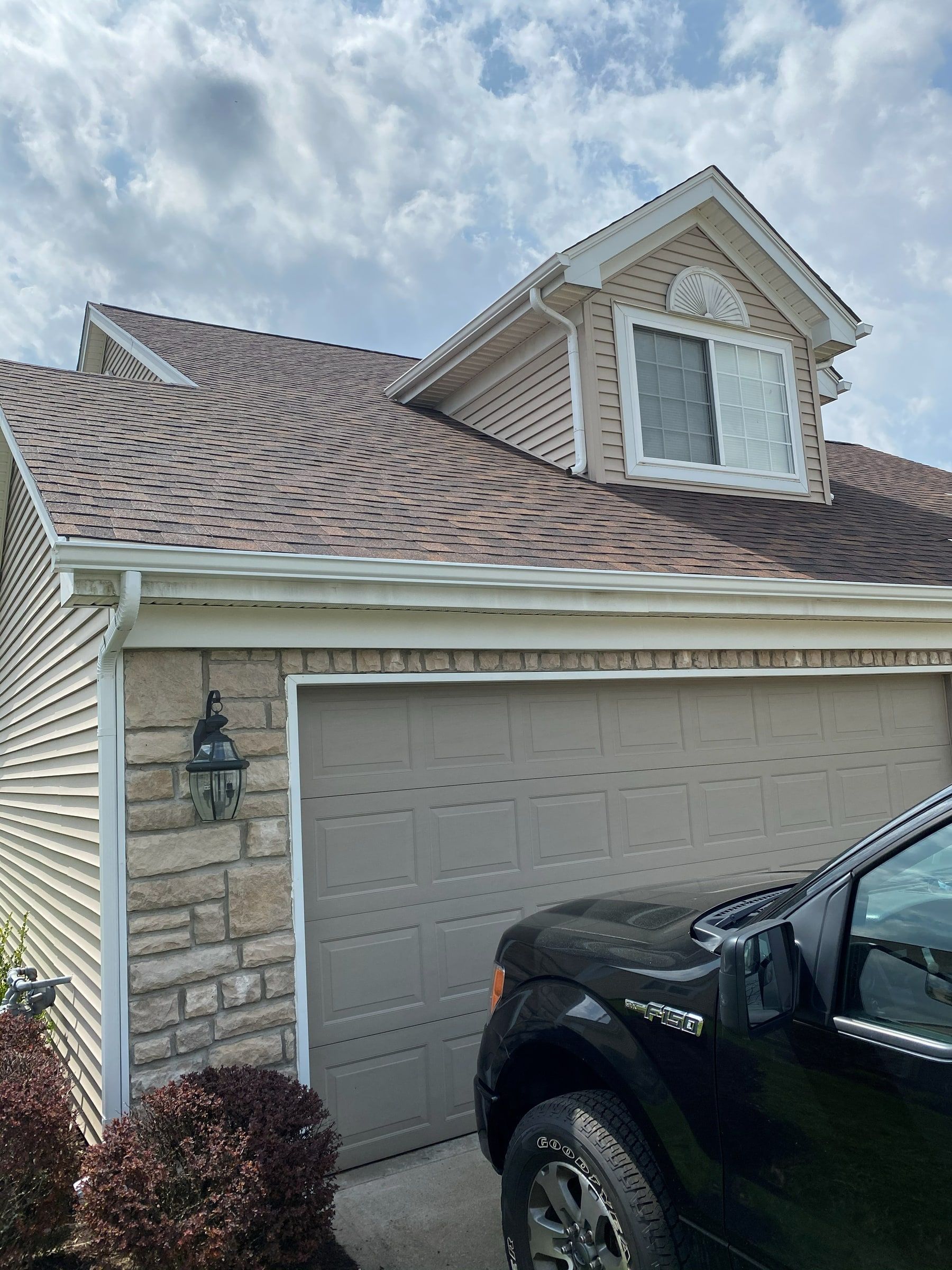 The new roof above the garage and the upper window, from the driveway, Xenia, Ohio.