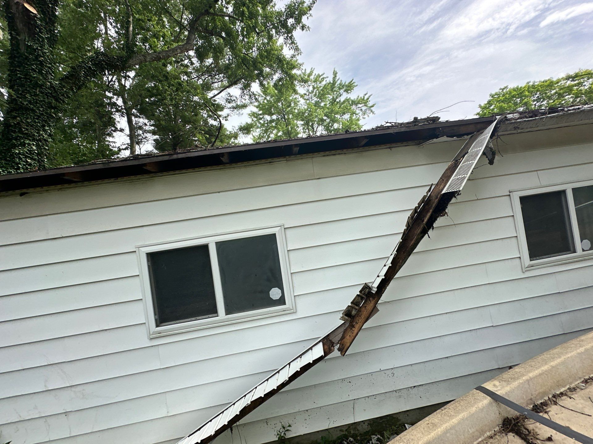 The garage gutter and fascia hanging off the roof edge, Beavercreek, Ohio.
