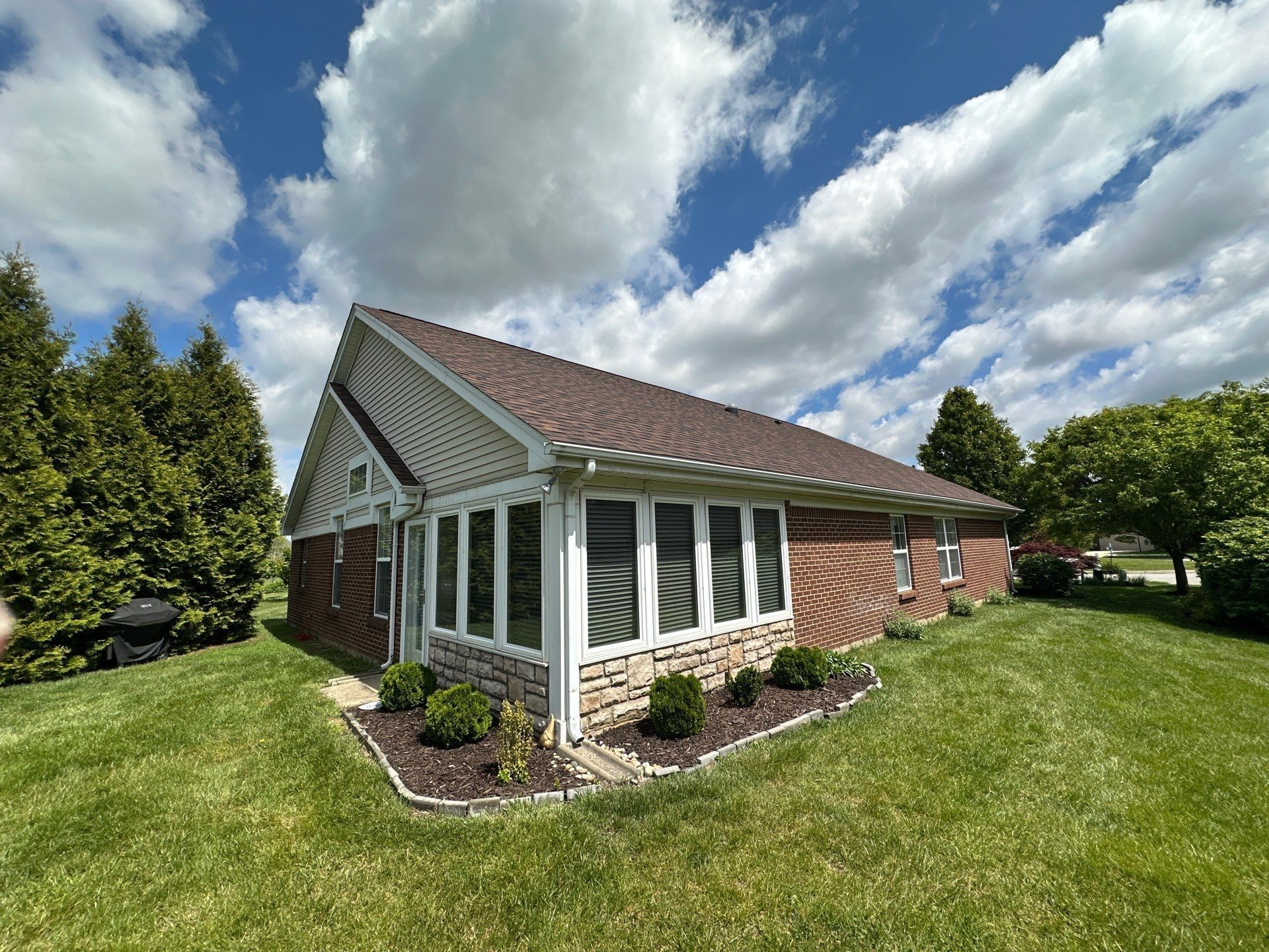 Roof above the stone sunroom corner