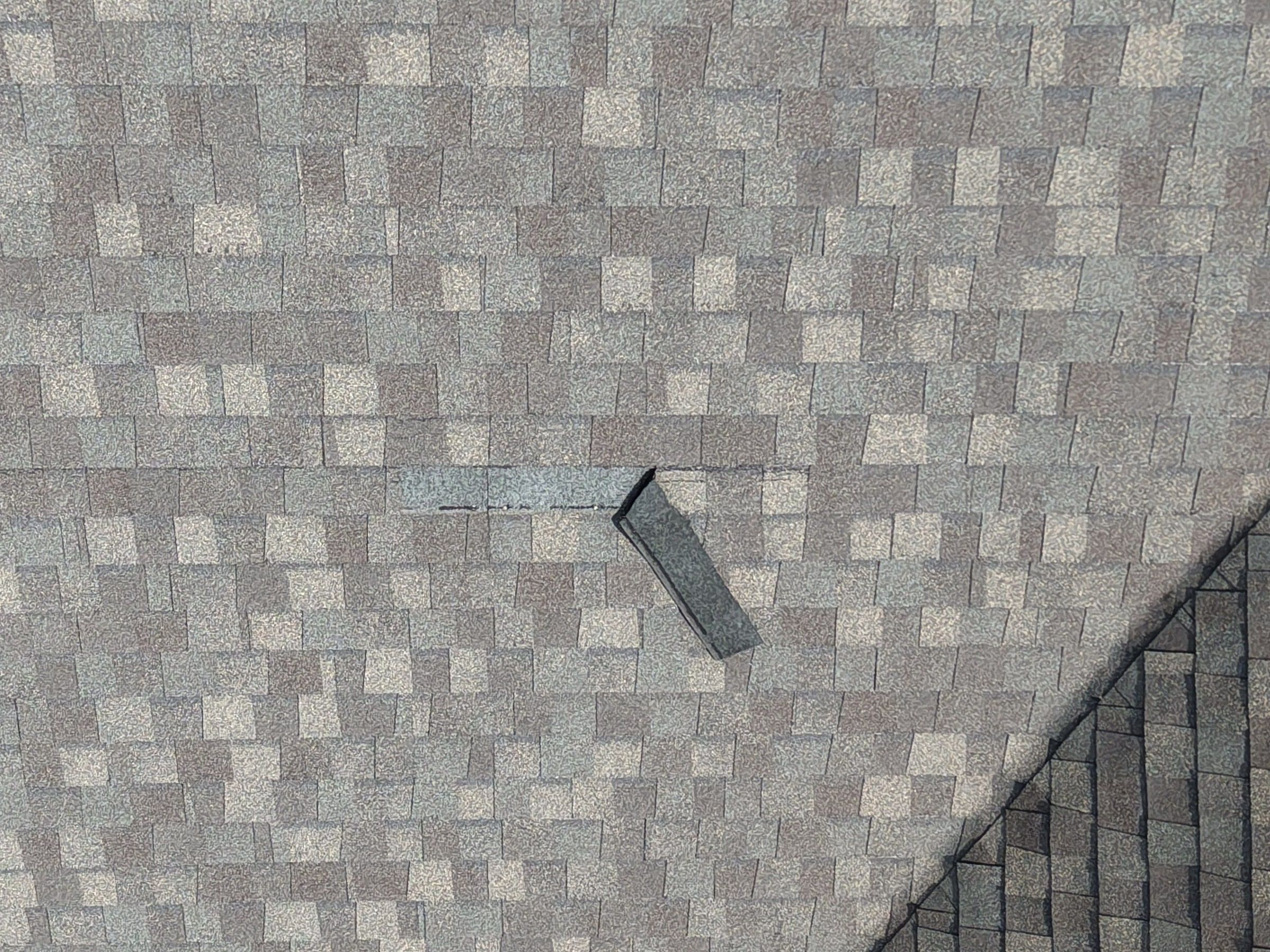 Drone photo of a lifted shingle on one slope, Xenia, Ohio.