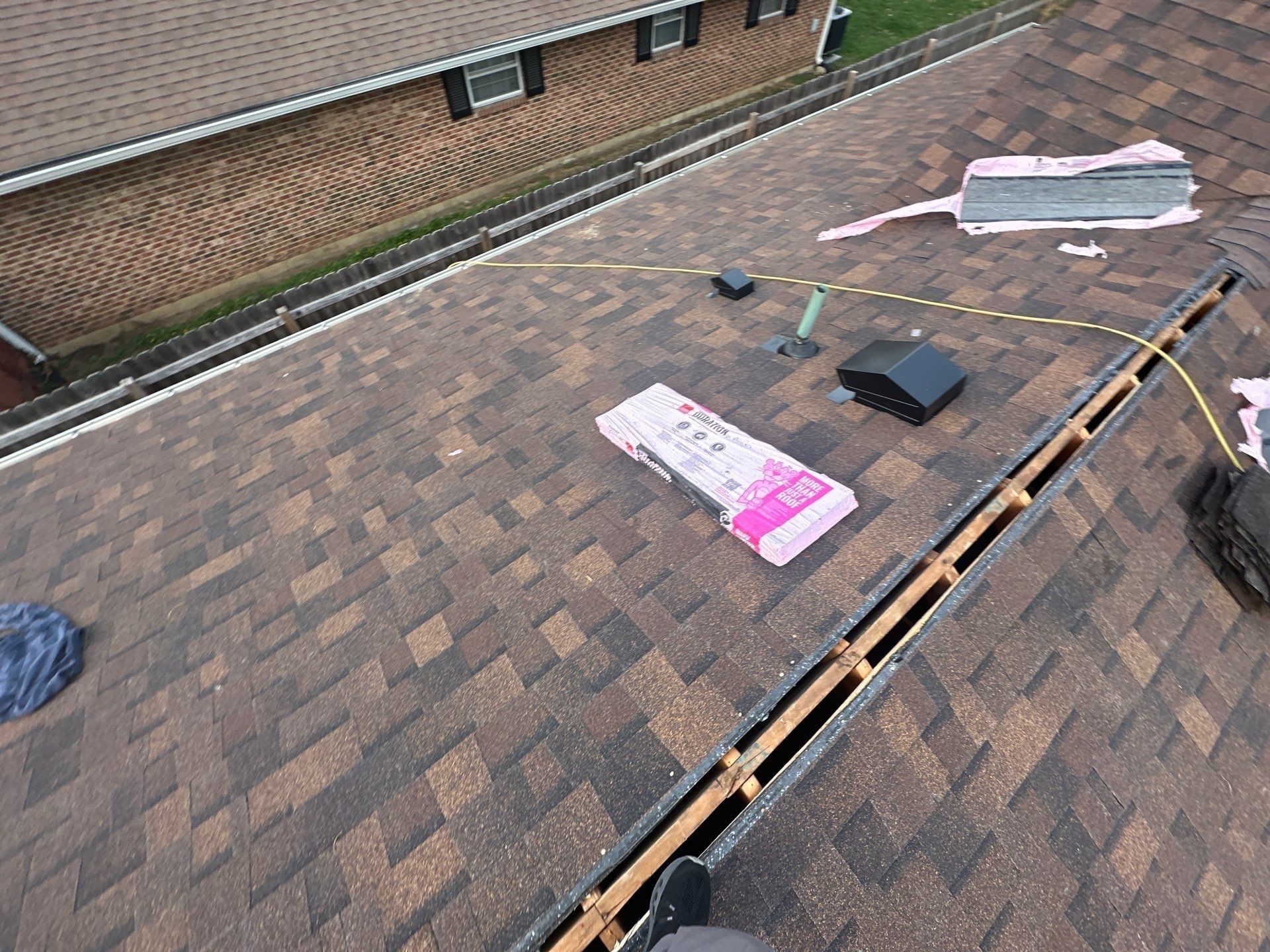 New shingles on both sides of the open ridge before the ridge vent went on, Dayton, Ohio.