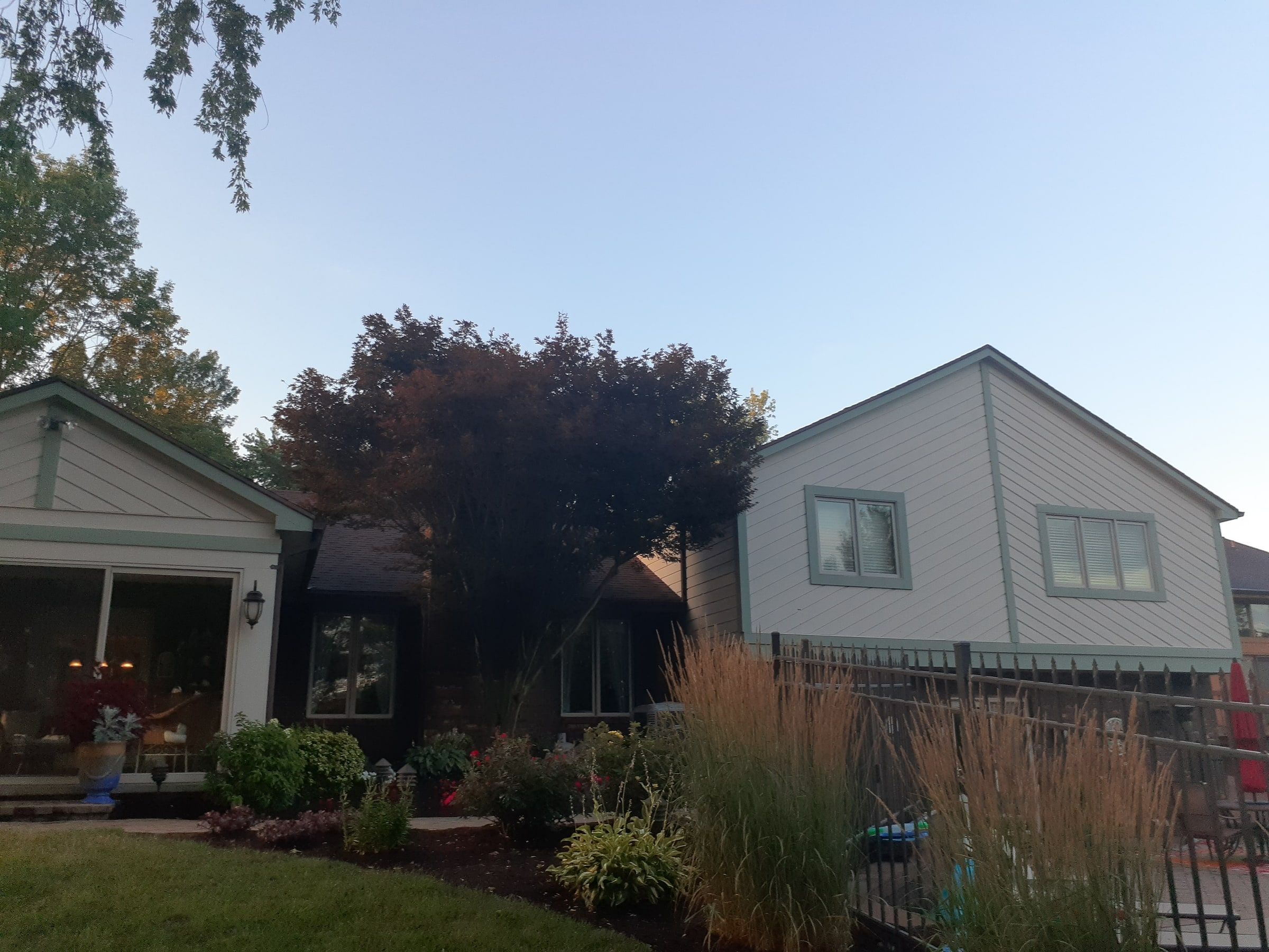 Backyard view of the sunroom and two story wing behind the garden, Jamestown, Ohio.