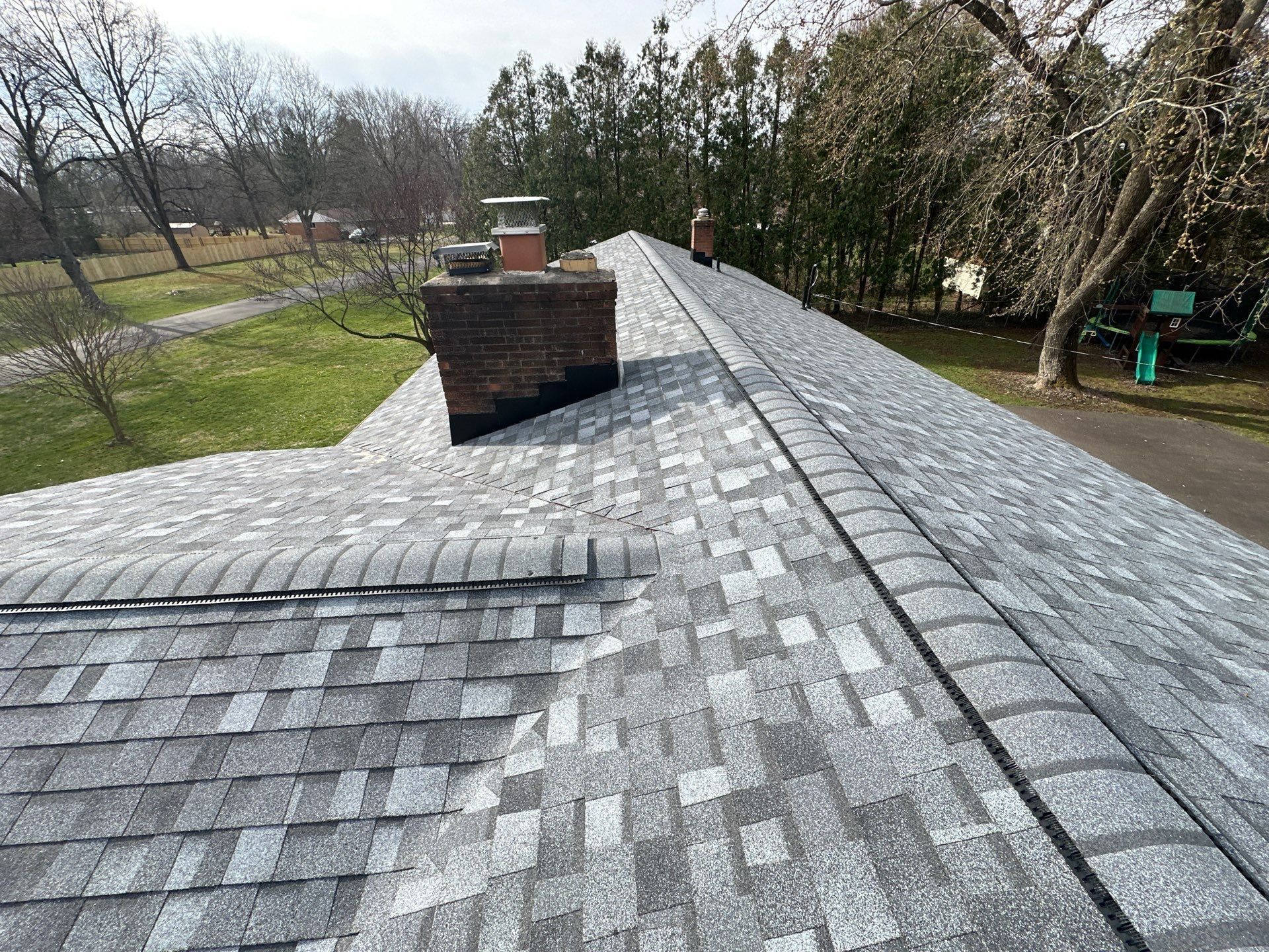Capped ridge past the brick chimney