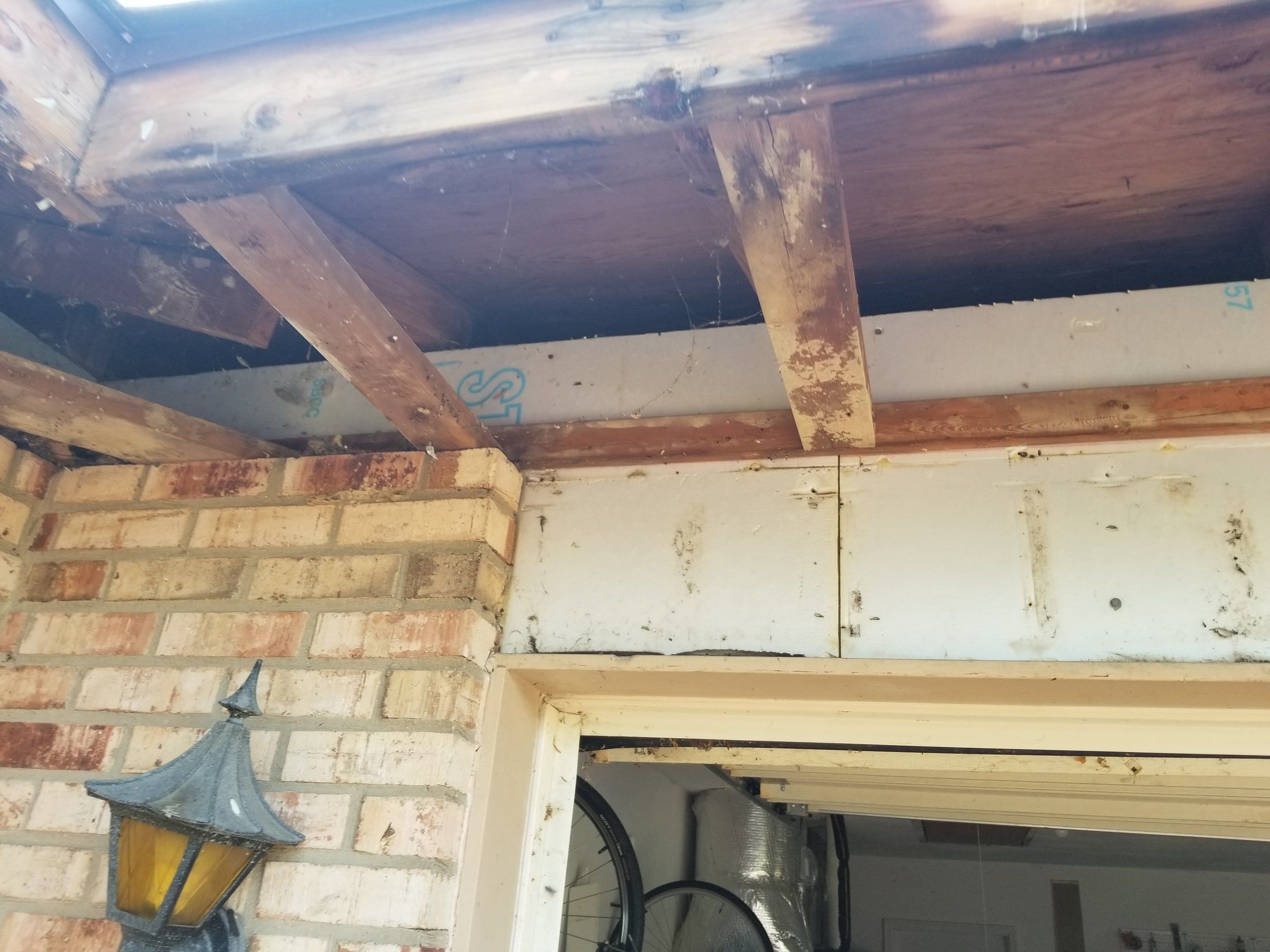 The wood above the open soffit at the garage corner, Beavercreek, Ohio.