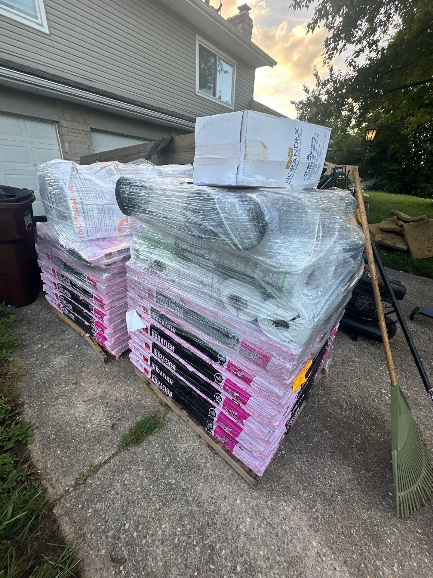 Two pallets of Duration shingles and supplies on the driveway, Fairborn, Ohio.