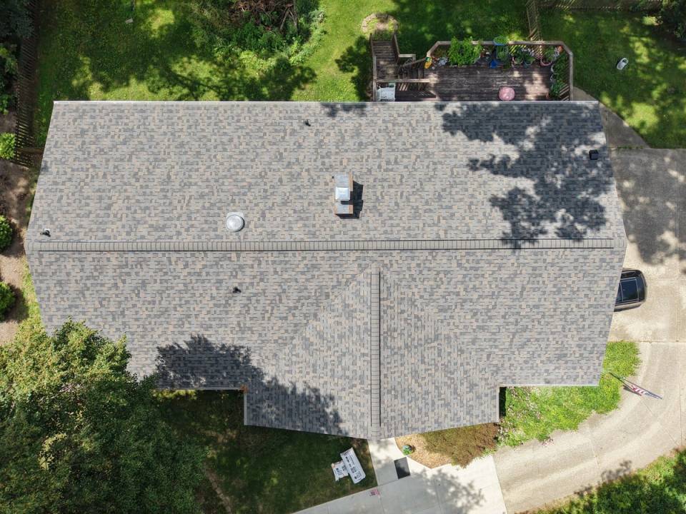 A finished shingle roof photographed from directly above.