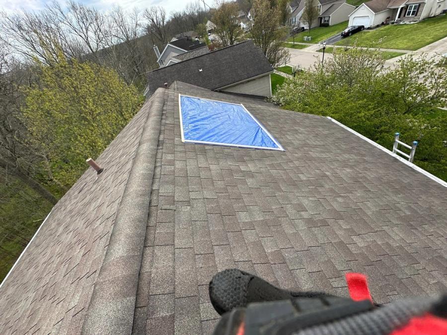 Blue tarp battened under timber strips