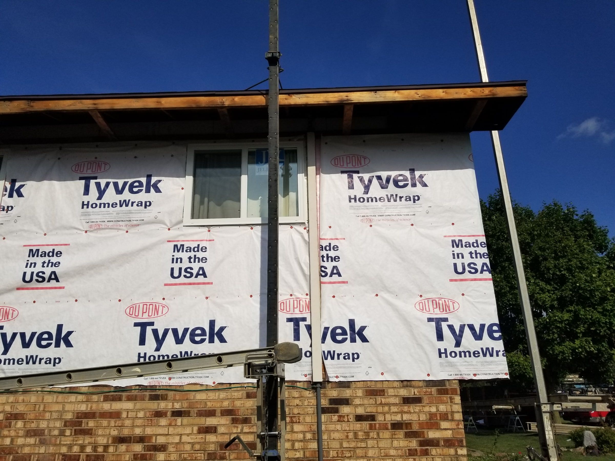 House wrap across the upper wall, close up under the eave, Beavercreek, Ohio.