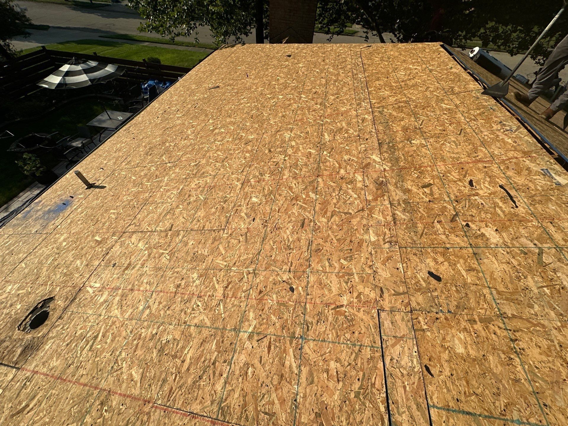 A long run of clean deck with a vent pipe opening near the eave, Dayton, Ohio.