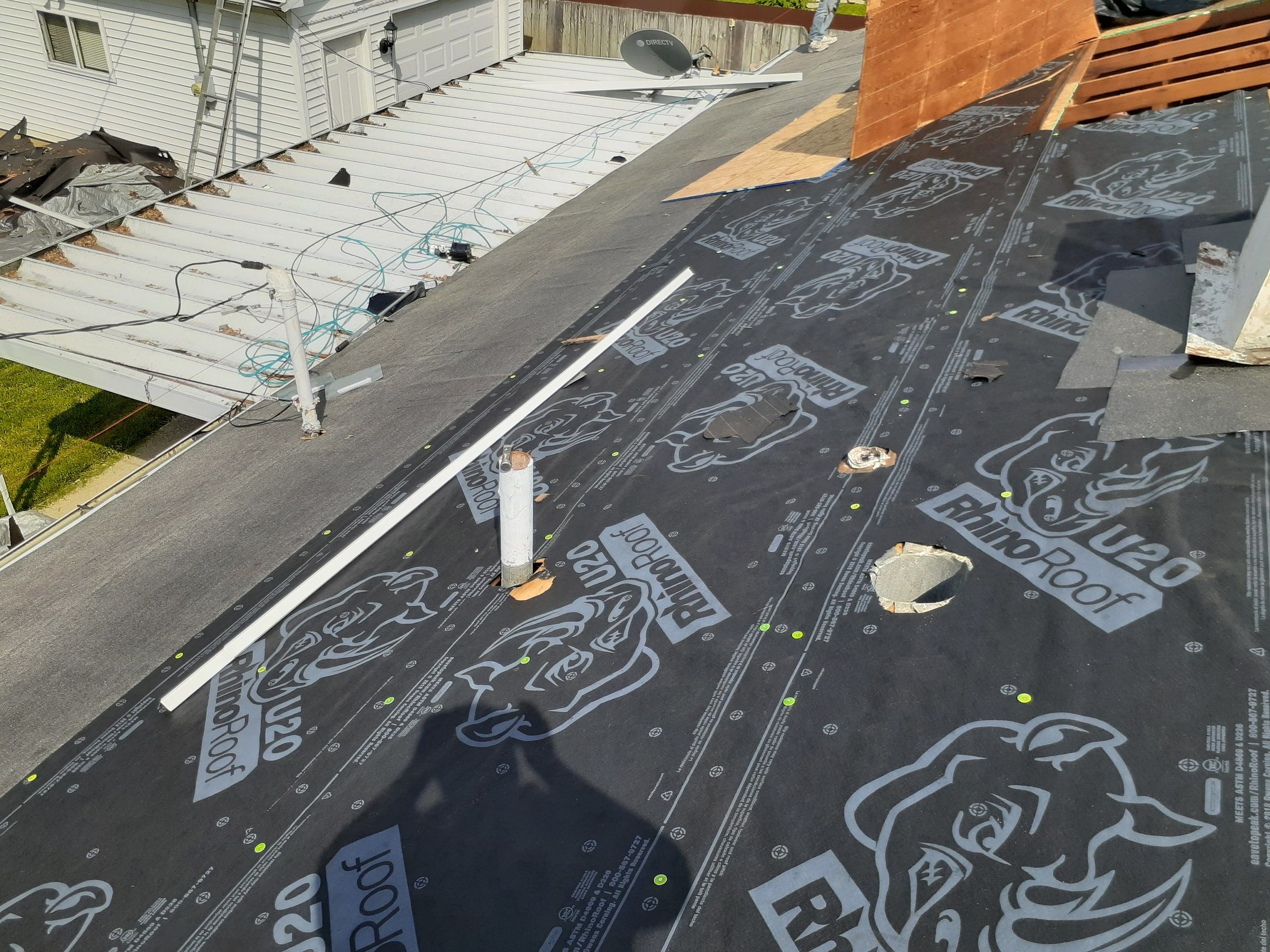 Synthetic underlayment around a vent pipe, with a strip of drip edge, Huber Heights, Ohio.