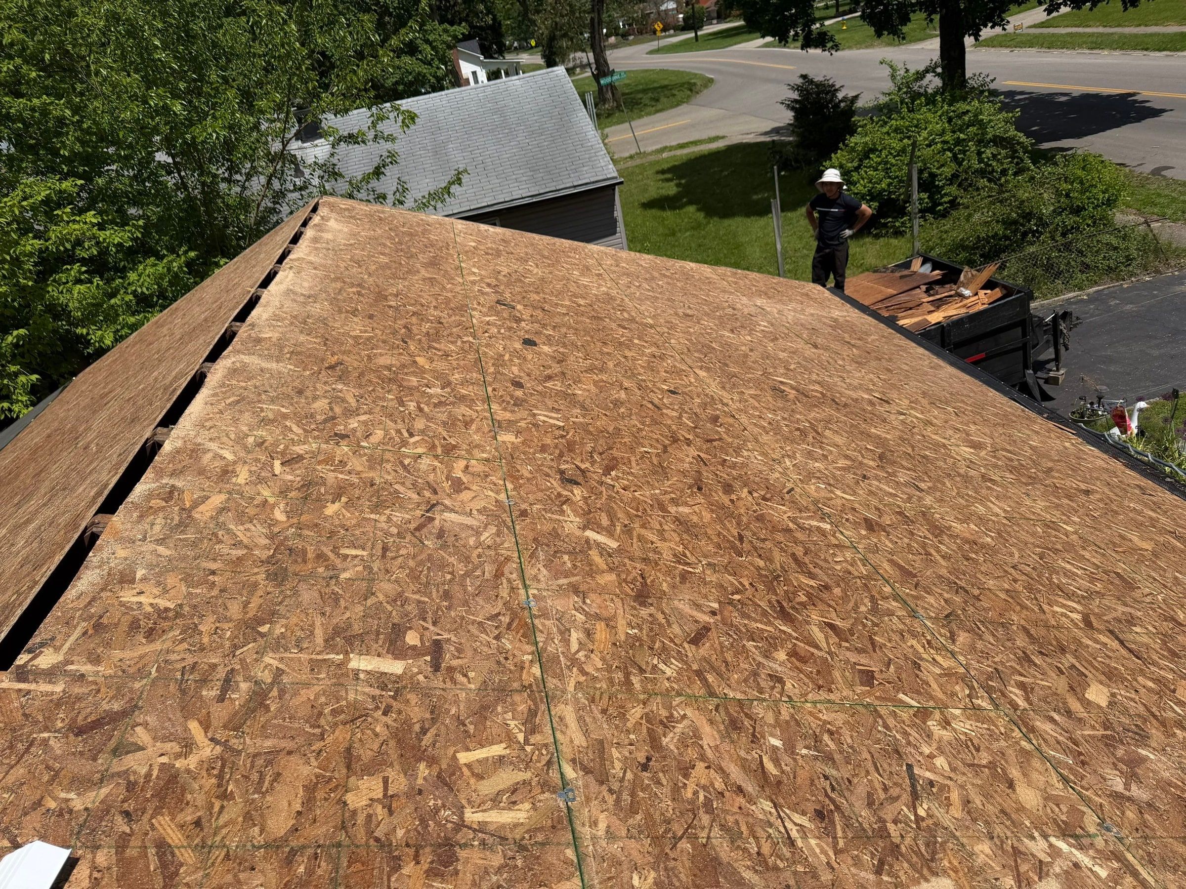 New OSB sheathing across the roof above the front yard, Dayton, Ohio.