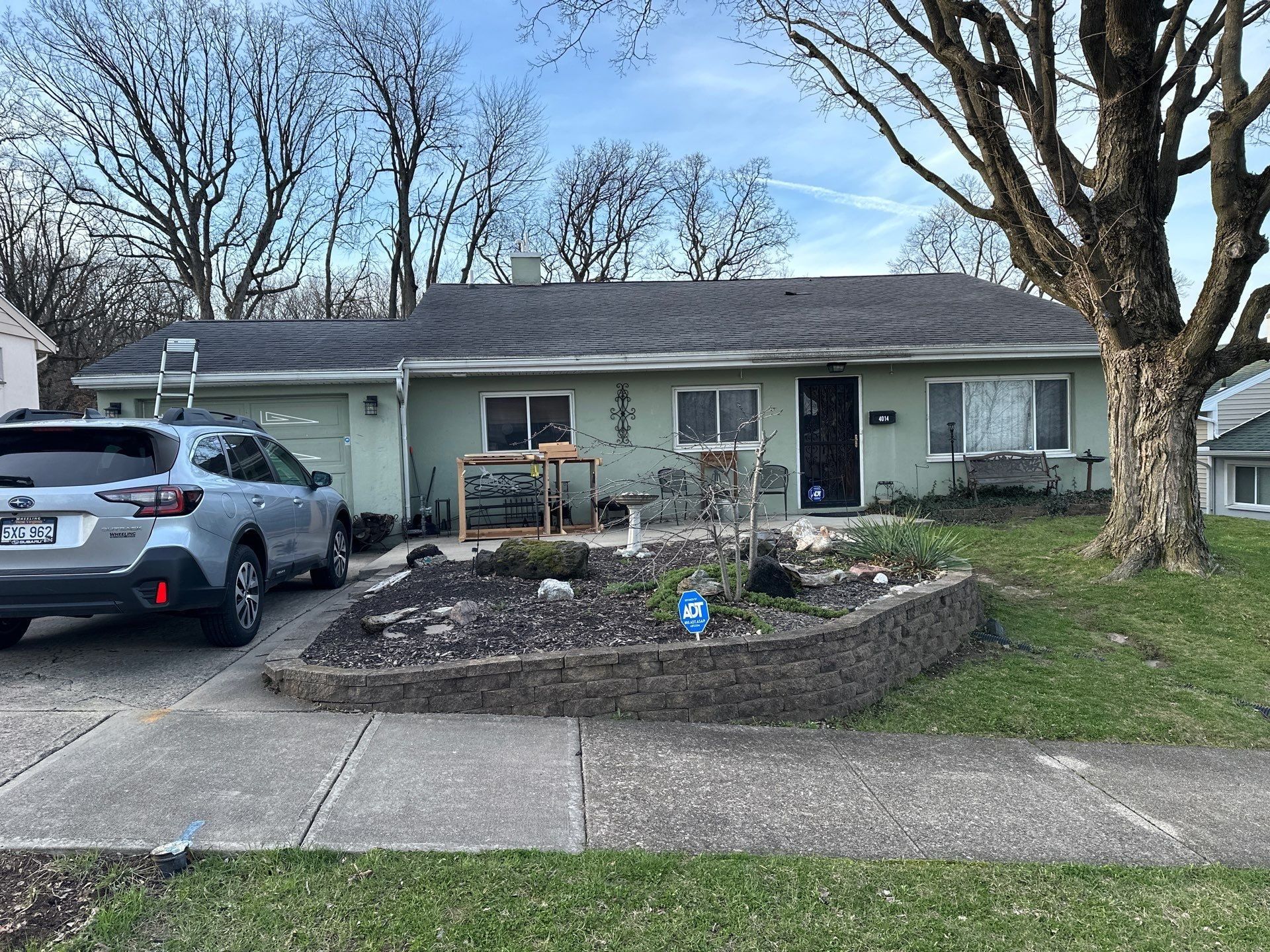Ranch from the street and a ladder