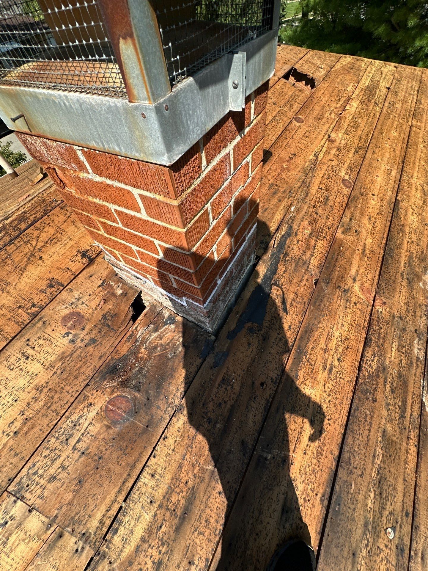 Darkened, rotted boards at the base of the faux chimney where the leak came in, Fairborn, Ohio.