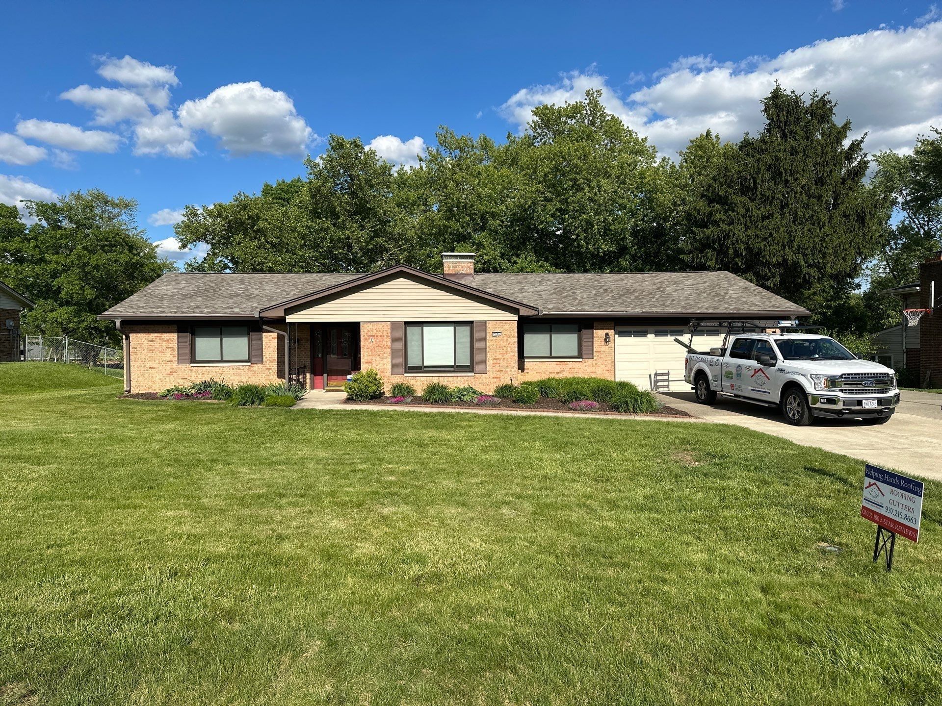 The finished roof on the brick ranch from the front lawn, Beavercreek, Ohio.