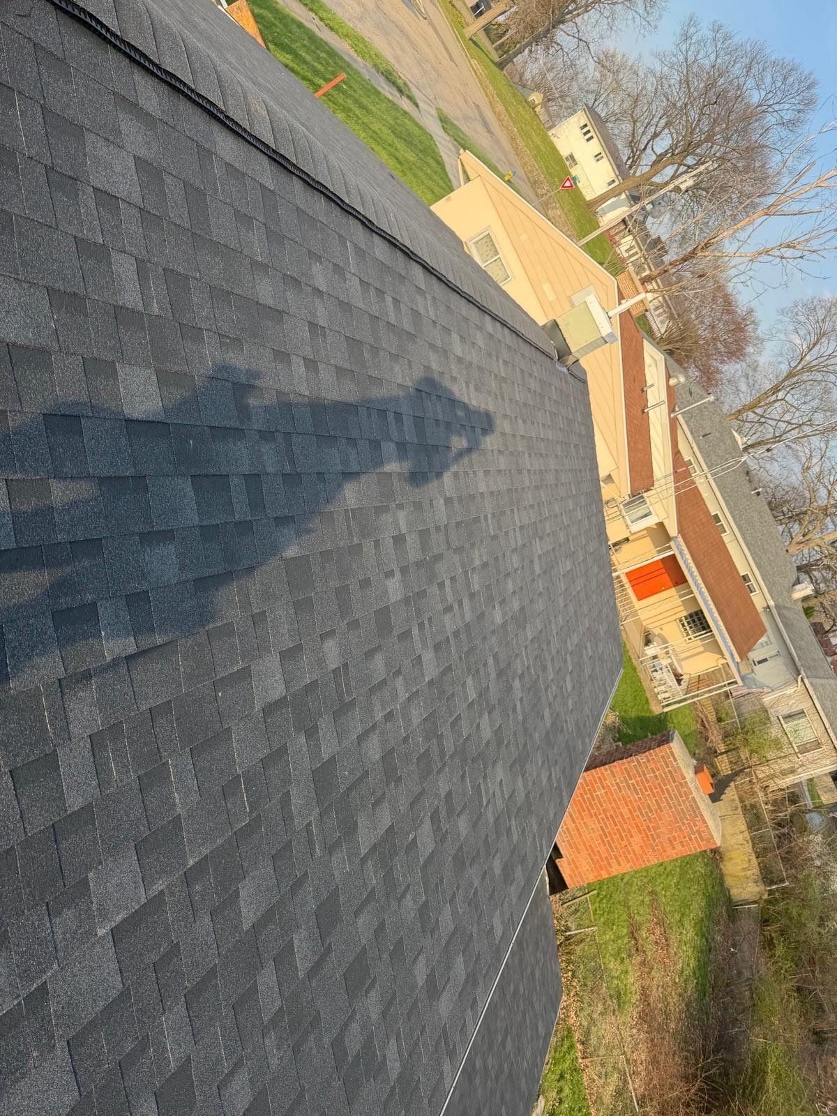 The finished shingle slope above the neighboring yards, Dayton, Ohio.