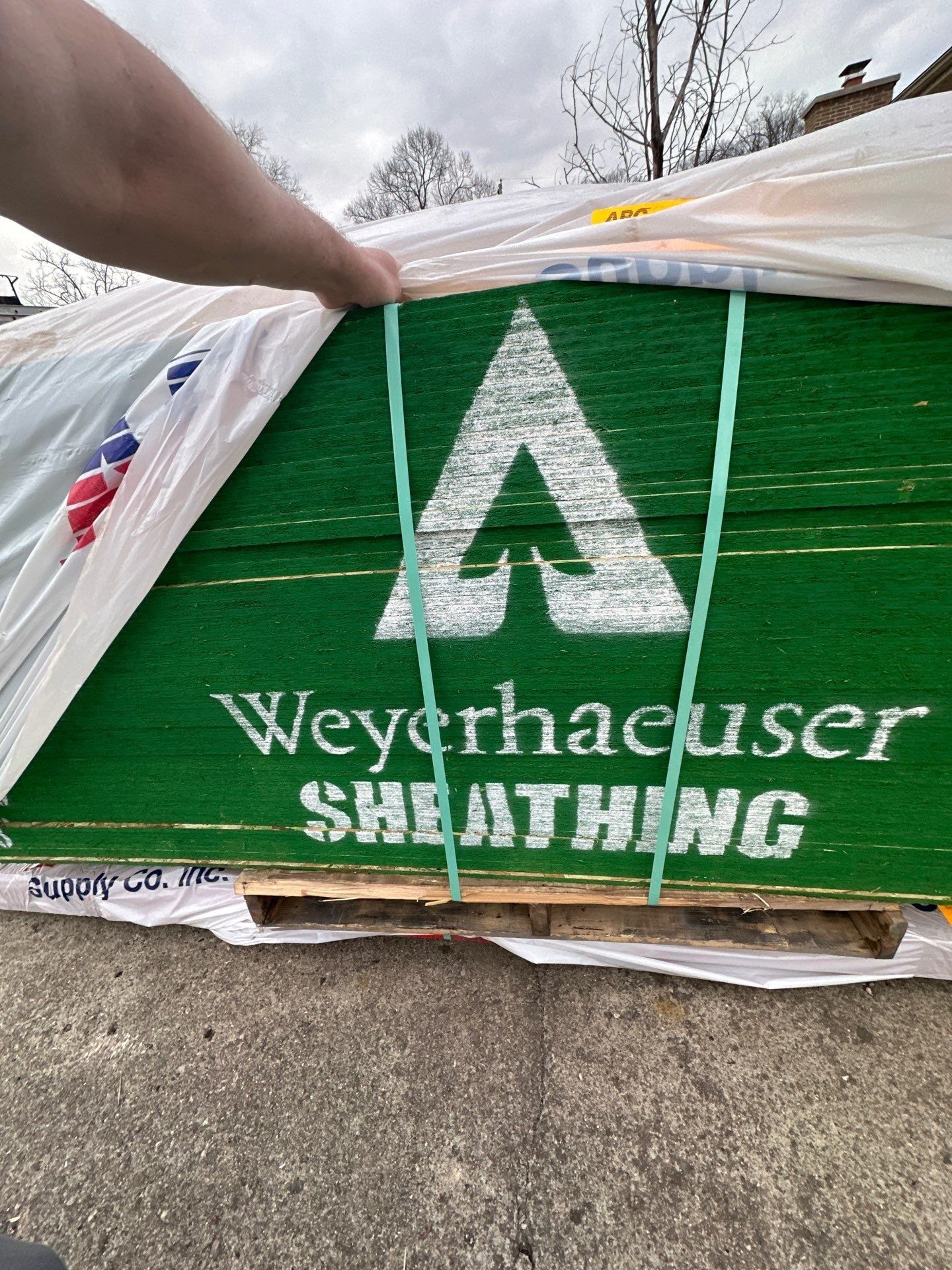 Weyerhaeuser sheathing pallet under lifted wrap