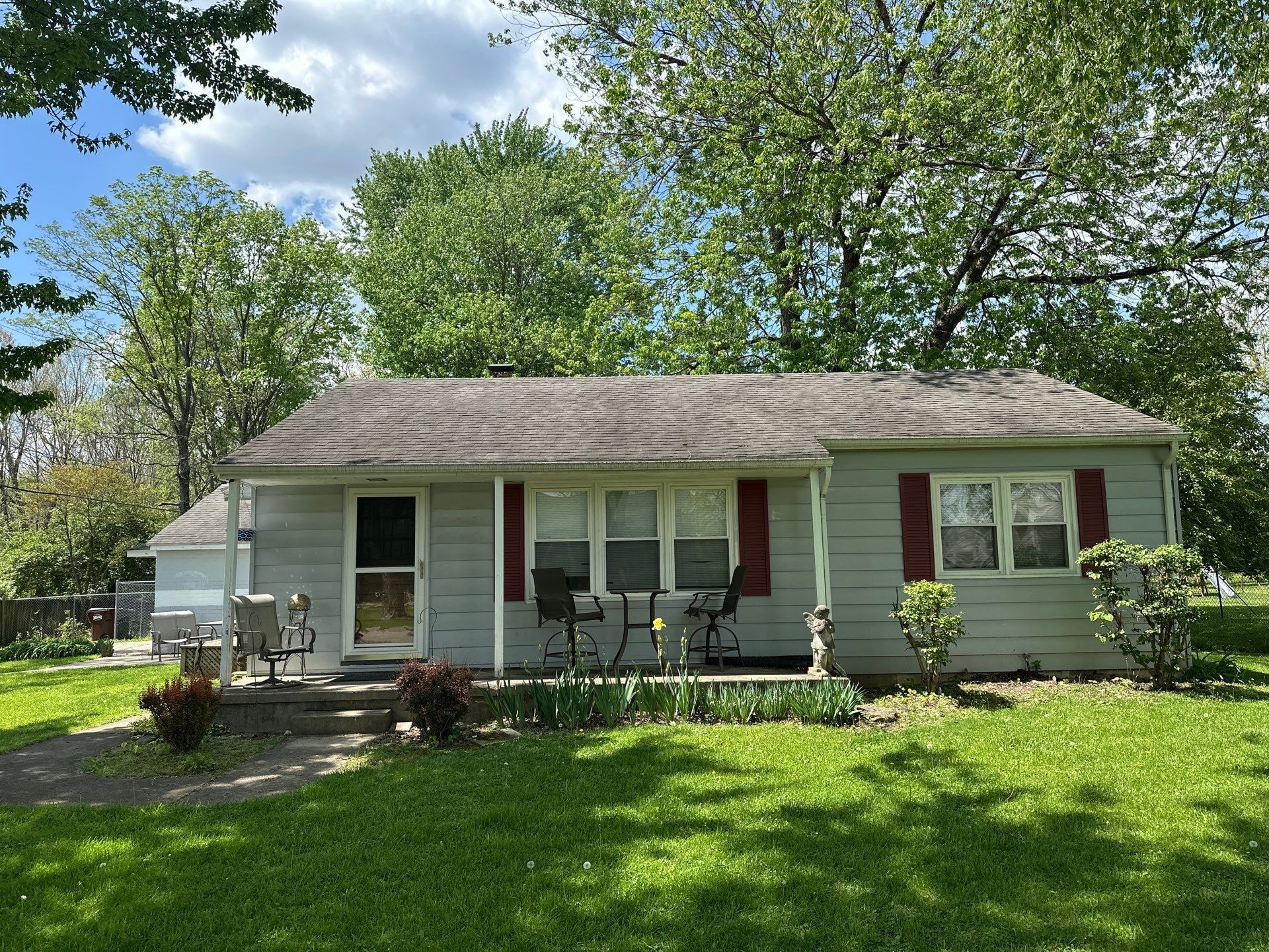 Pale green ranch, roof and siding