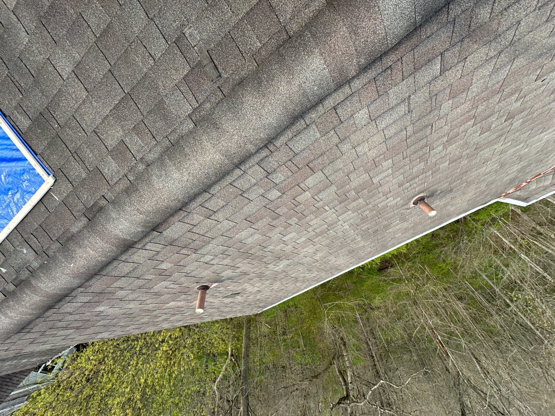 Two pipe vents and a blue sheet