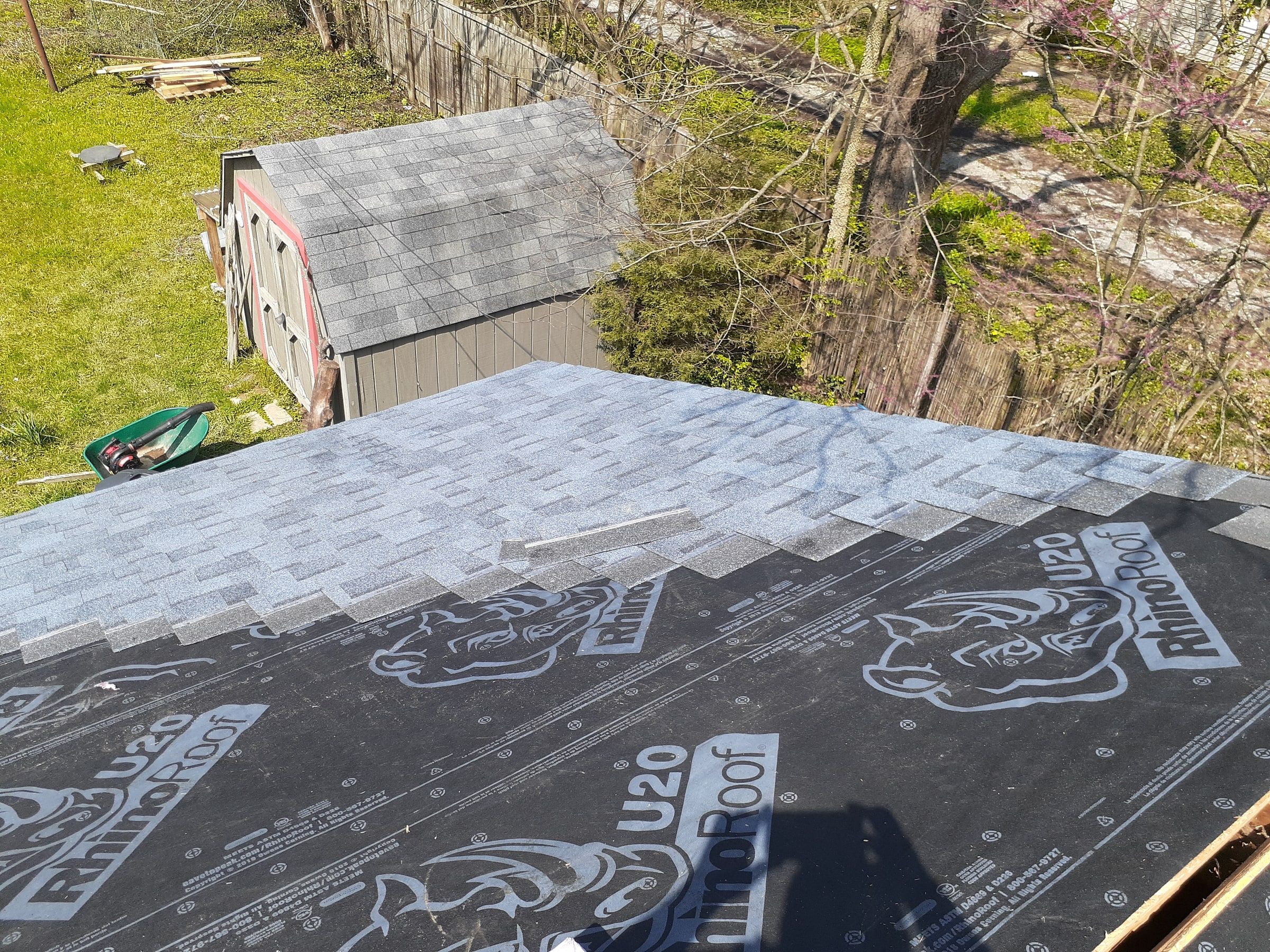 The first courses of new shingles going on over the synthetic underlayment, Yellow Springs, Ohio.