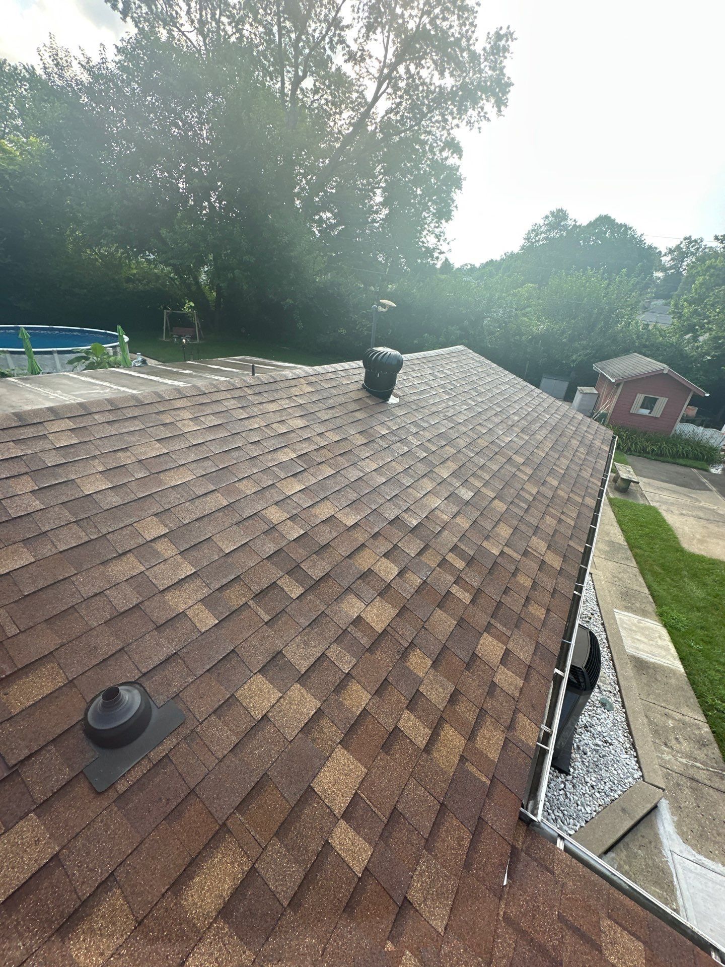 The finished roof and gutter above the side yard, Beavercreek, Ohio.