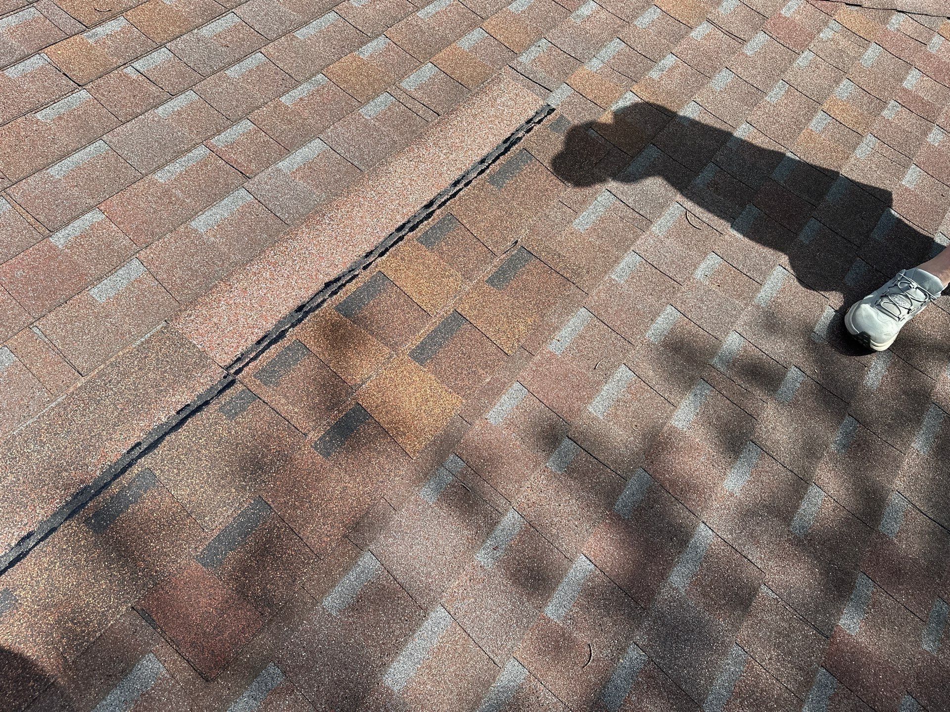 A row of sample shingles laid across the old roof for the ITEL comparison, Dayton, Ohio.