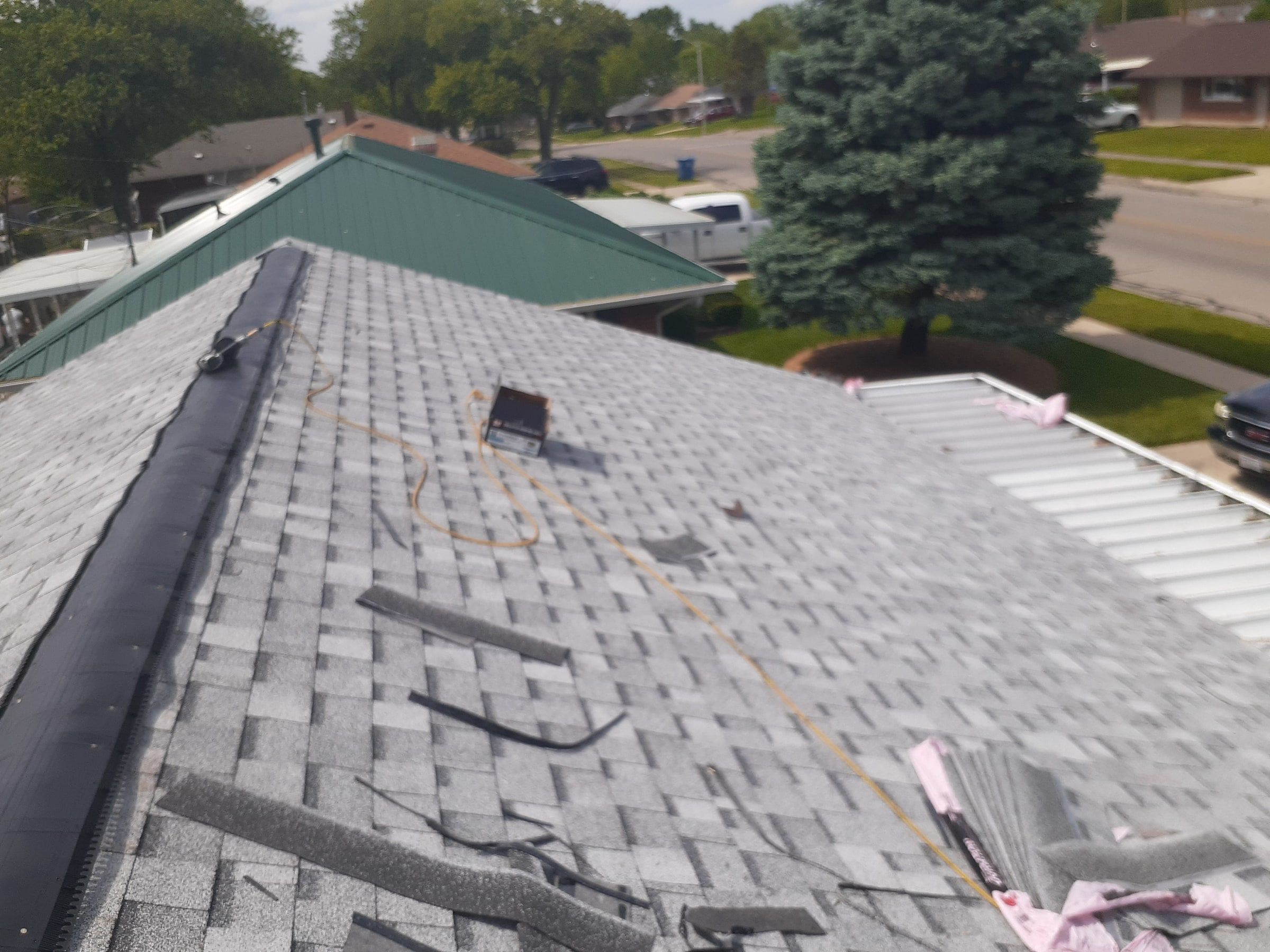 Ridge vent going on along the top of the roof, Huber Heights, Ohio.