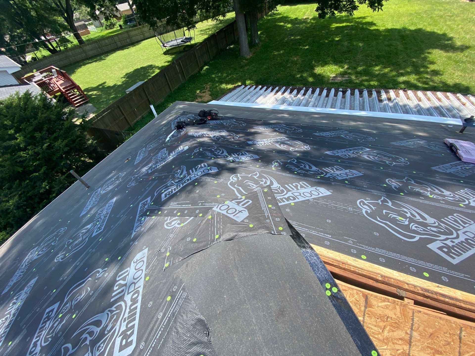 Underlayment folded over the transition where the roof meets the patio cover, Beavercreek, Ohio.