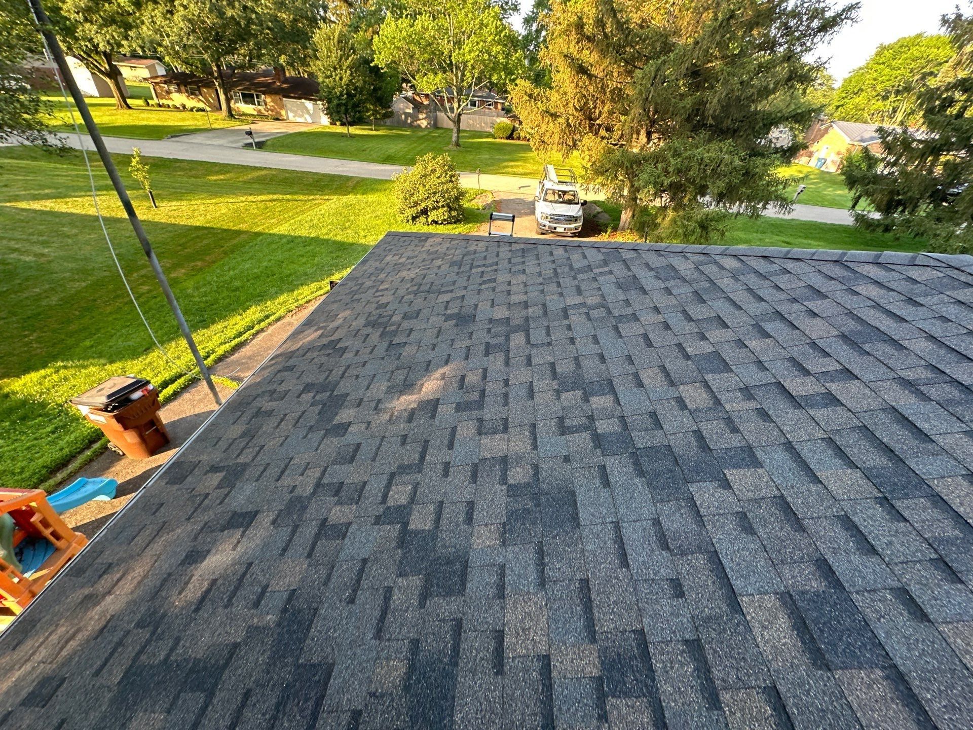 Final front slope of new shingles above the driveway and yard, Beavercreek, Ohio.