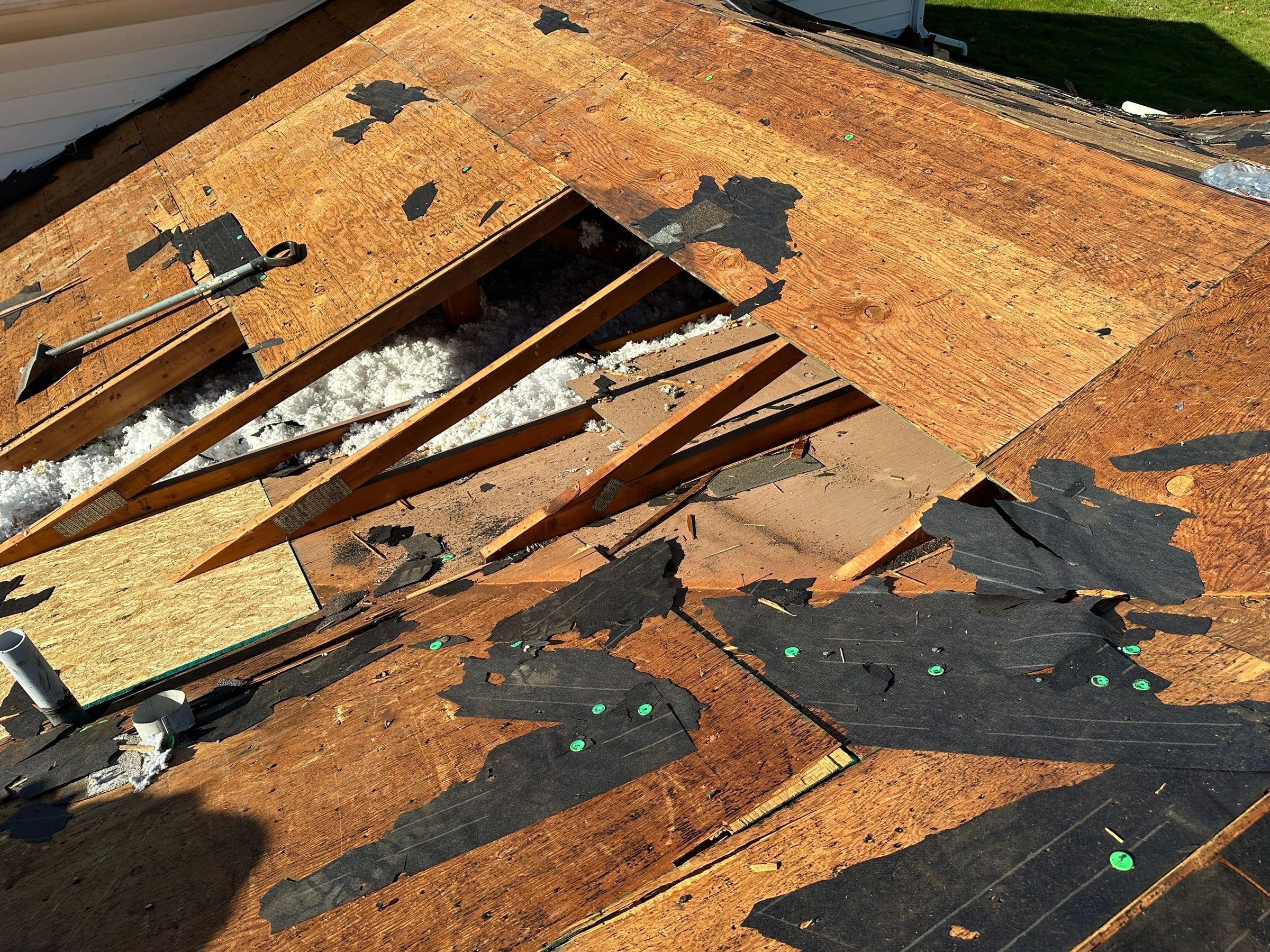 A hole through the rotted deck, down to the attic insulation, West Carrollton, Ohio.