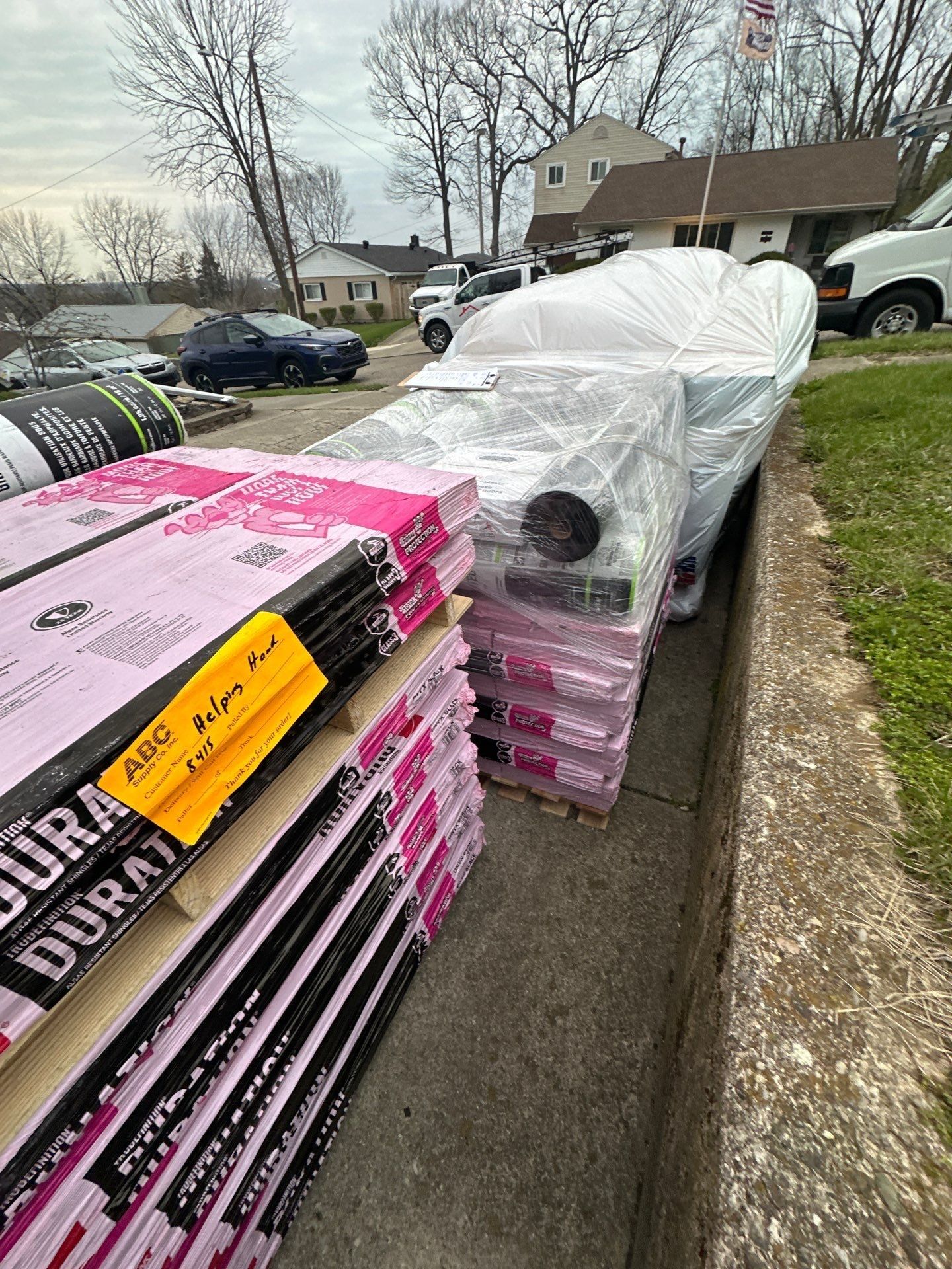 Pallets of Owens Corning Duration shingles along the driveway, Dayton, Ohio.