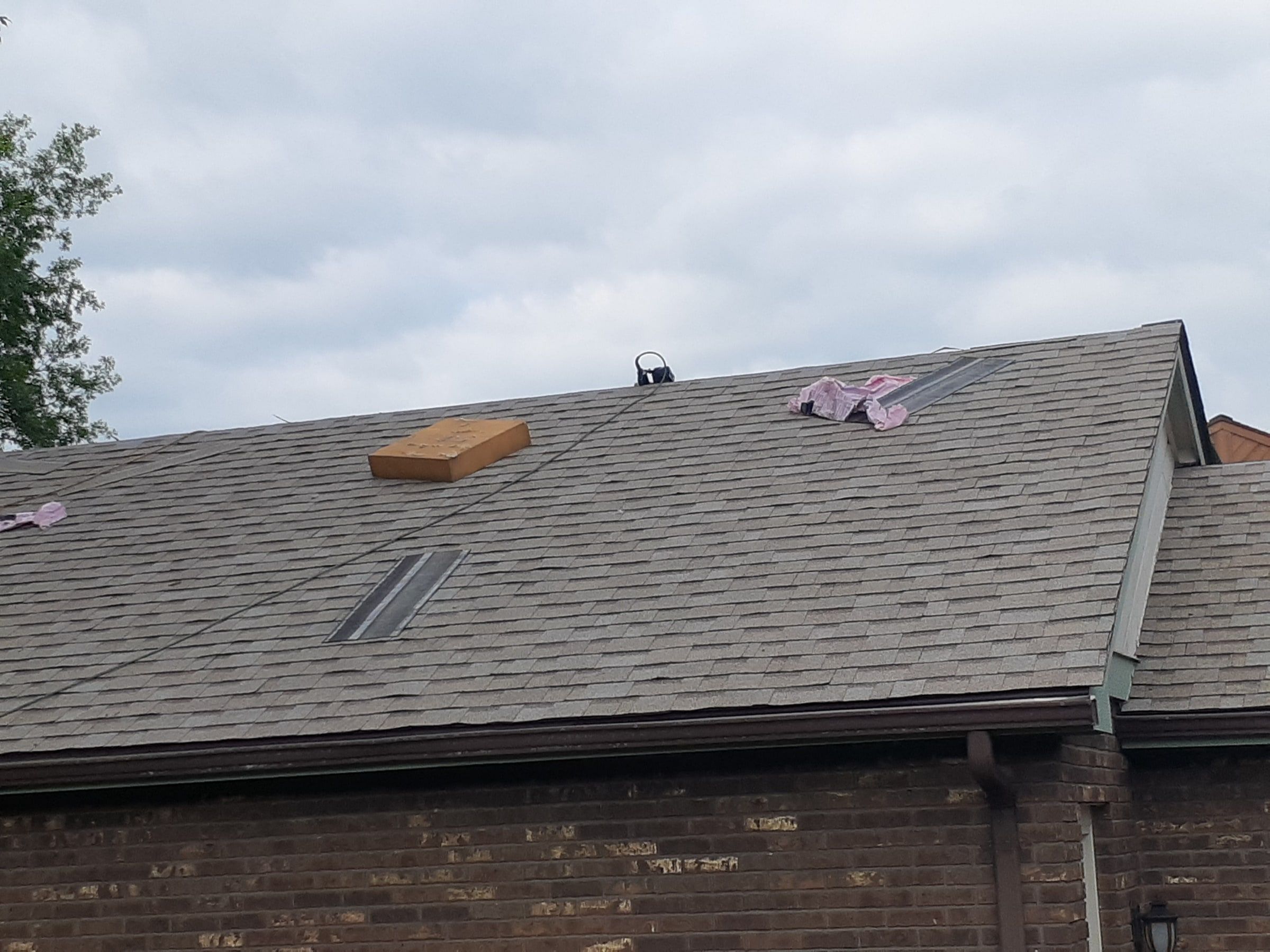 The new shingles over the garage from the ground, with a bundle still on top, Jamestown, Ohio.