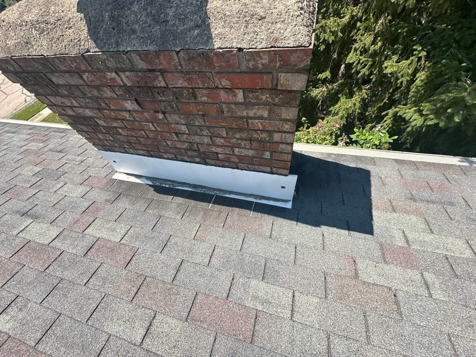 Old flashing along the base of the brick chimney, West Carrollton, Ohio.