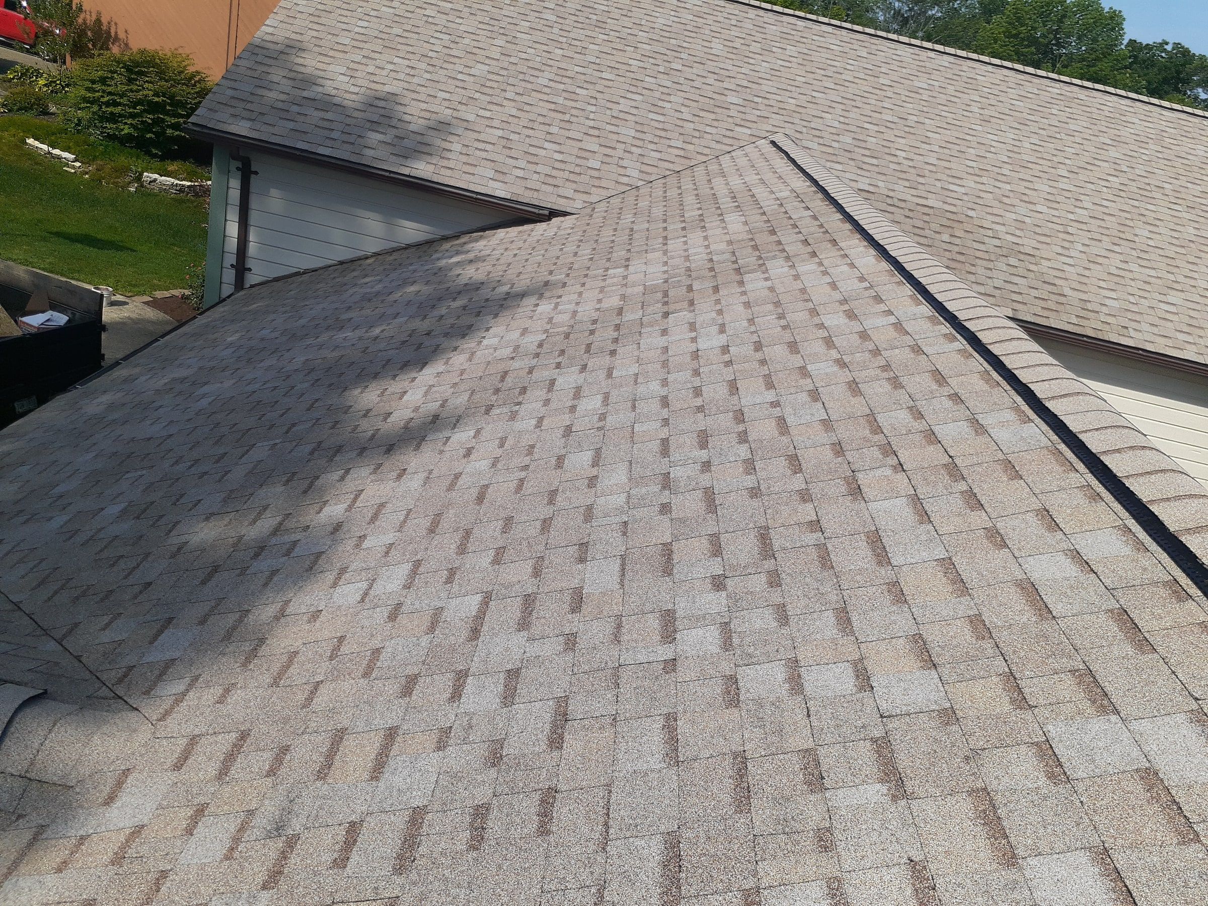 Finished slope meeting the garage roof with clean edges, Jamestown, Ohio.