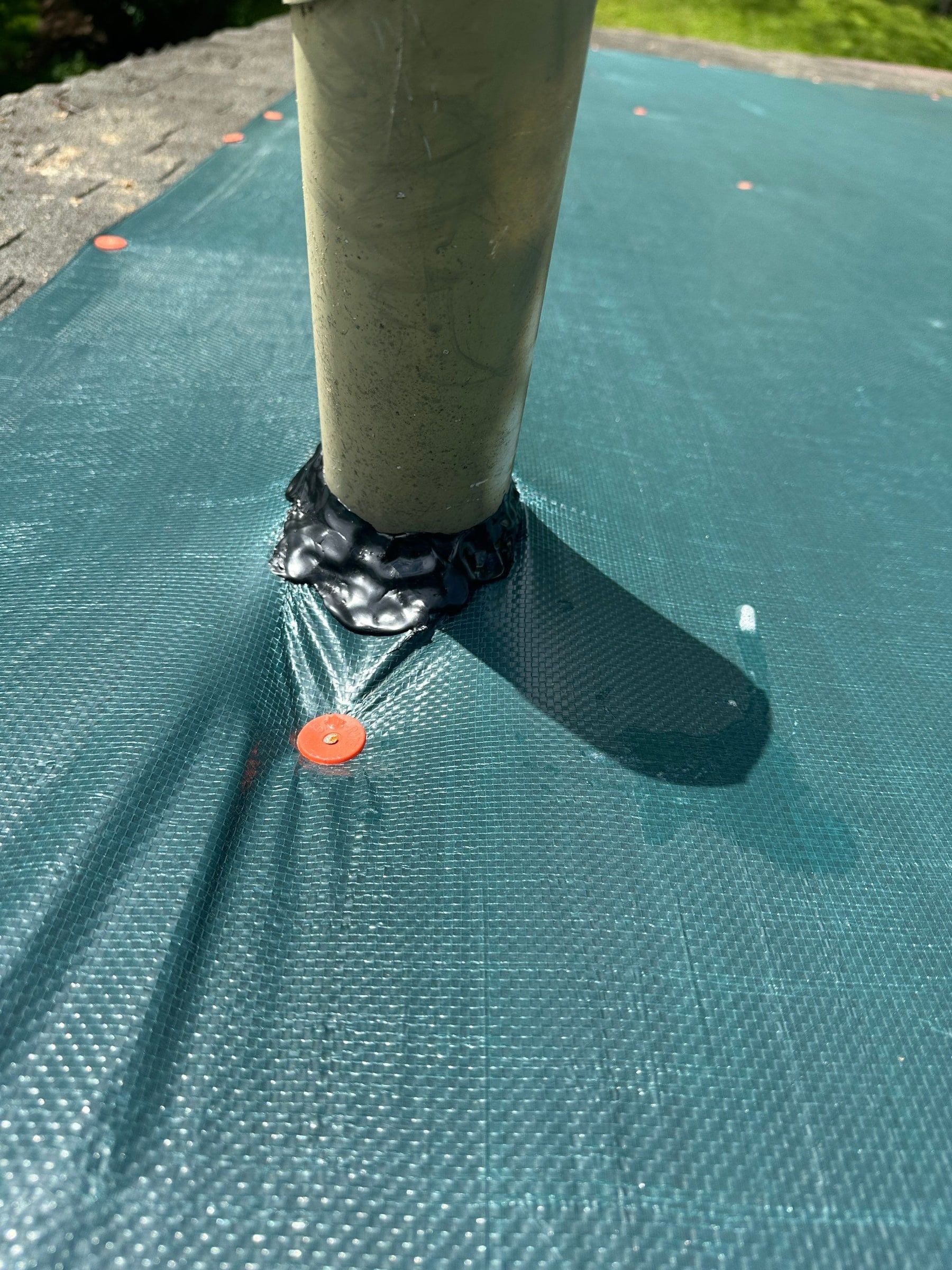 Tarp cut in around a vent stack