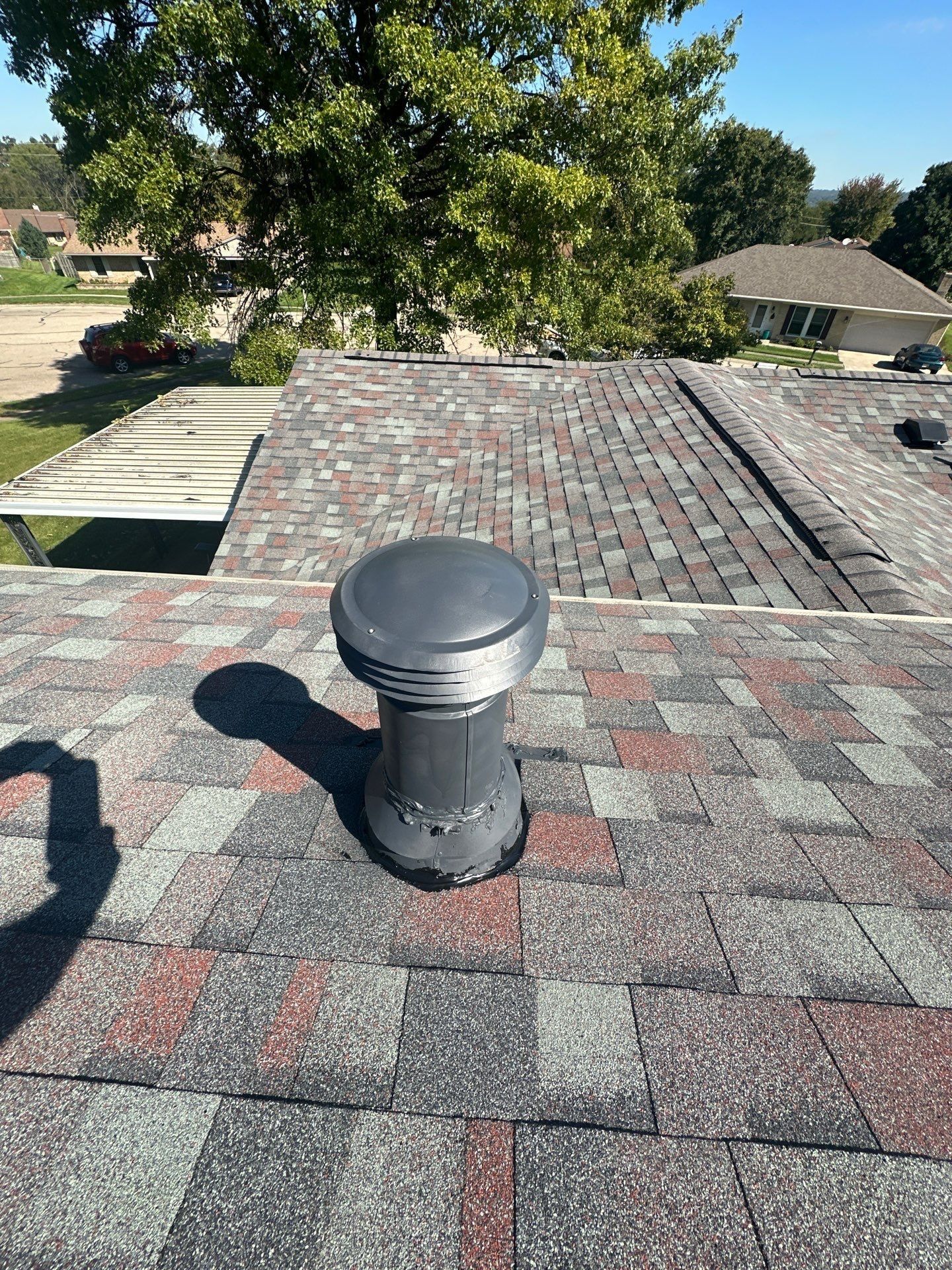 A new round vent cap on the finished roof, West Carrollton, Ohio.