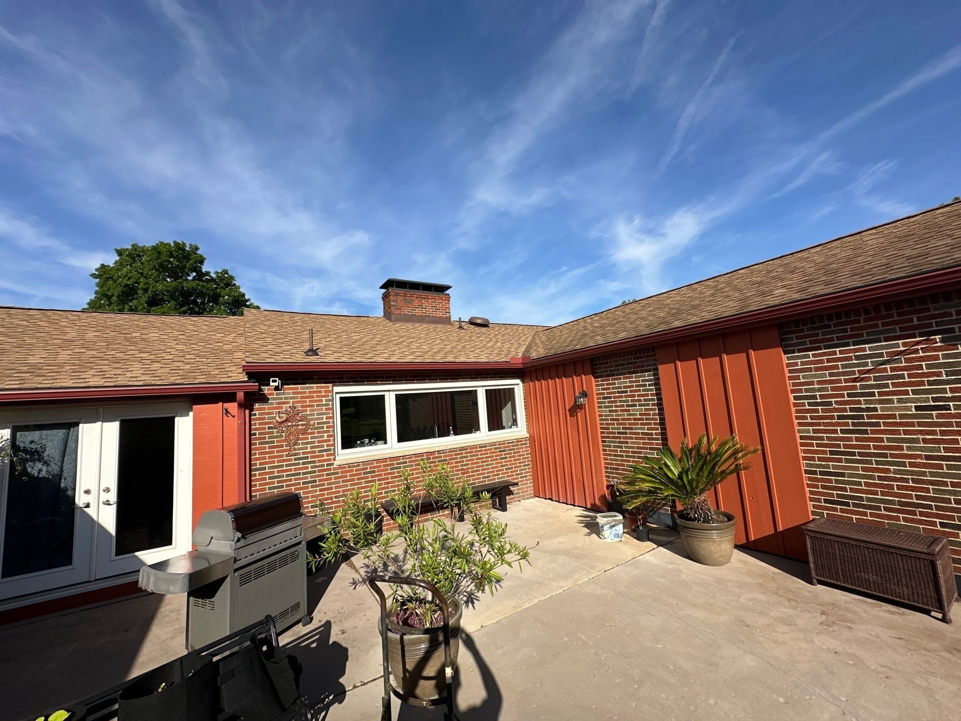 Roof above brick and batten walls