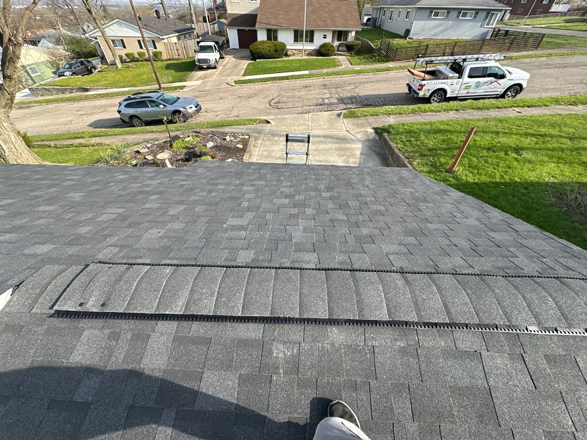 The finished roof and ridge vent above the front yard, Dayton, Ohio.