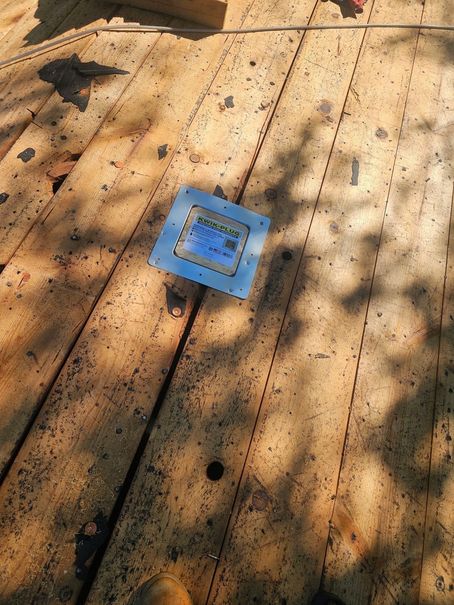 A new metal vent base set into the plank deck, Kettering, Ohio.
