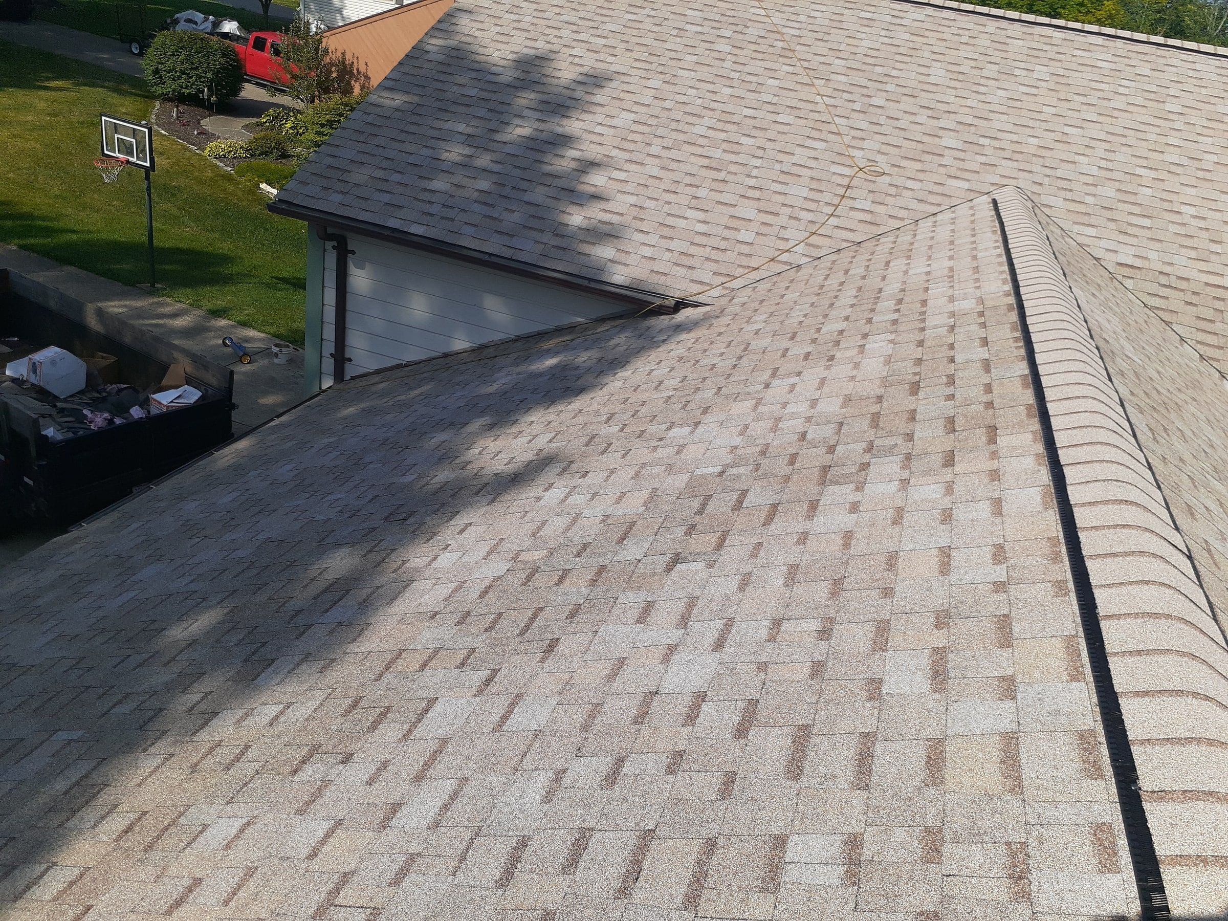 Ridge vent running the length of the roof under cap shingles, Jamestown, Ohio.