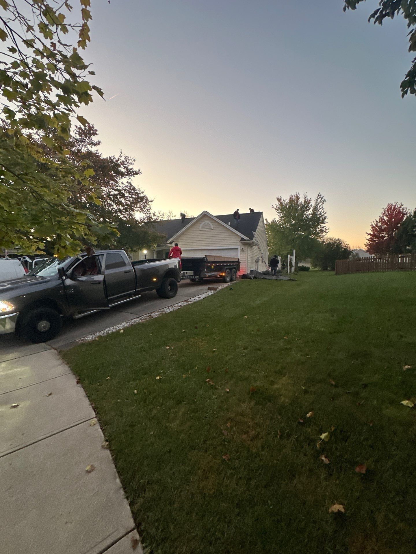 The crew's truck and trailer in the driveway at sunrise on install day, Beavercreek, Ohio.
